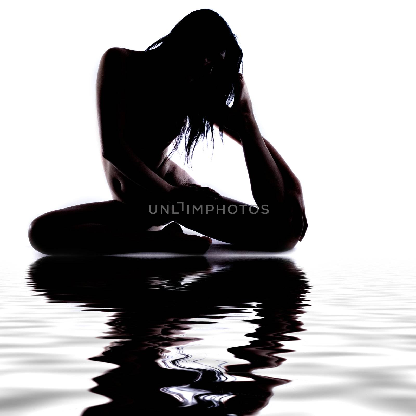 Silhouette of a gymnast in the water by DNFStyle