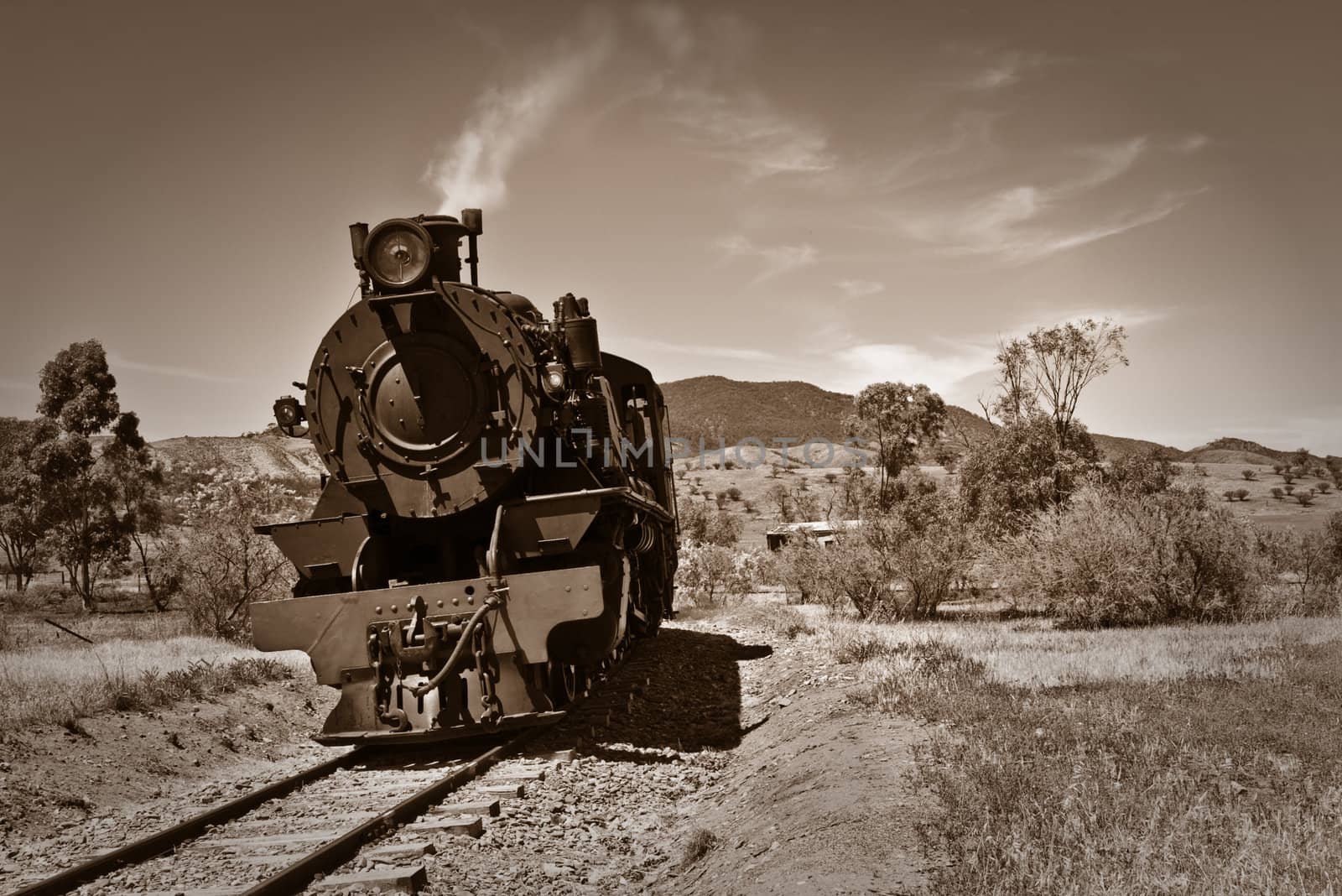 sepia brown image of an old steam train 