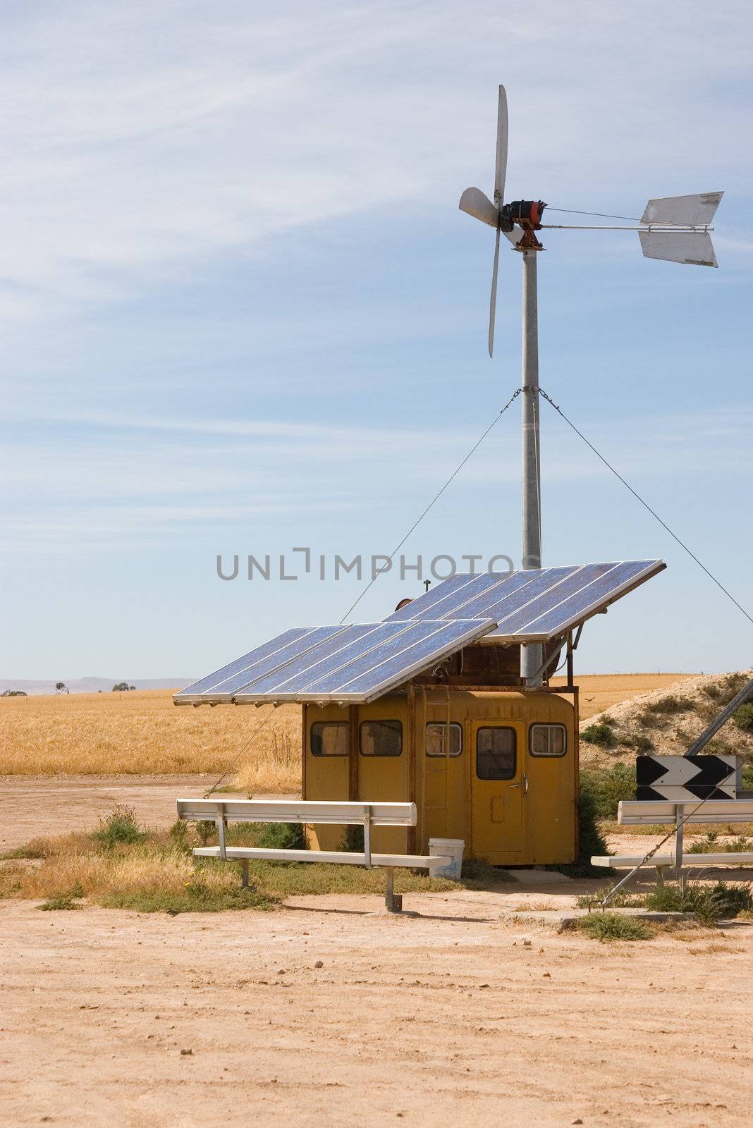 homemade wind and solar energy sources at an alternative energy farm using recycled materials