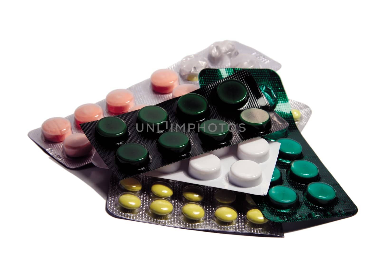 old pills in plastic pack isolated on white bacground