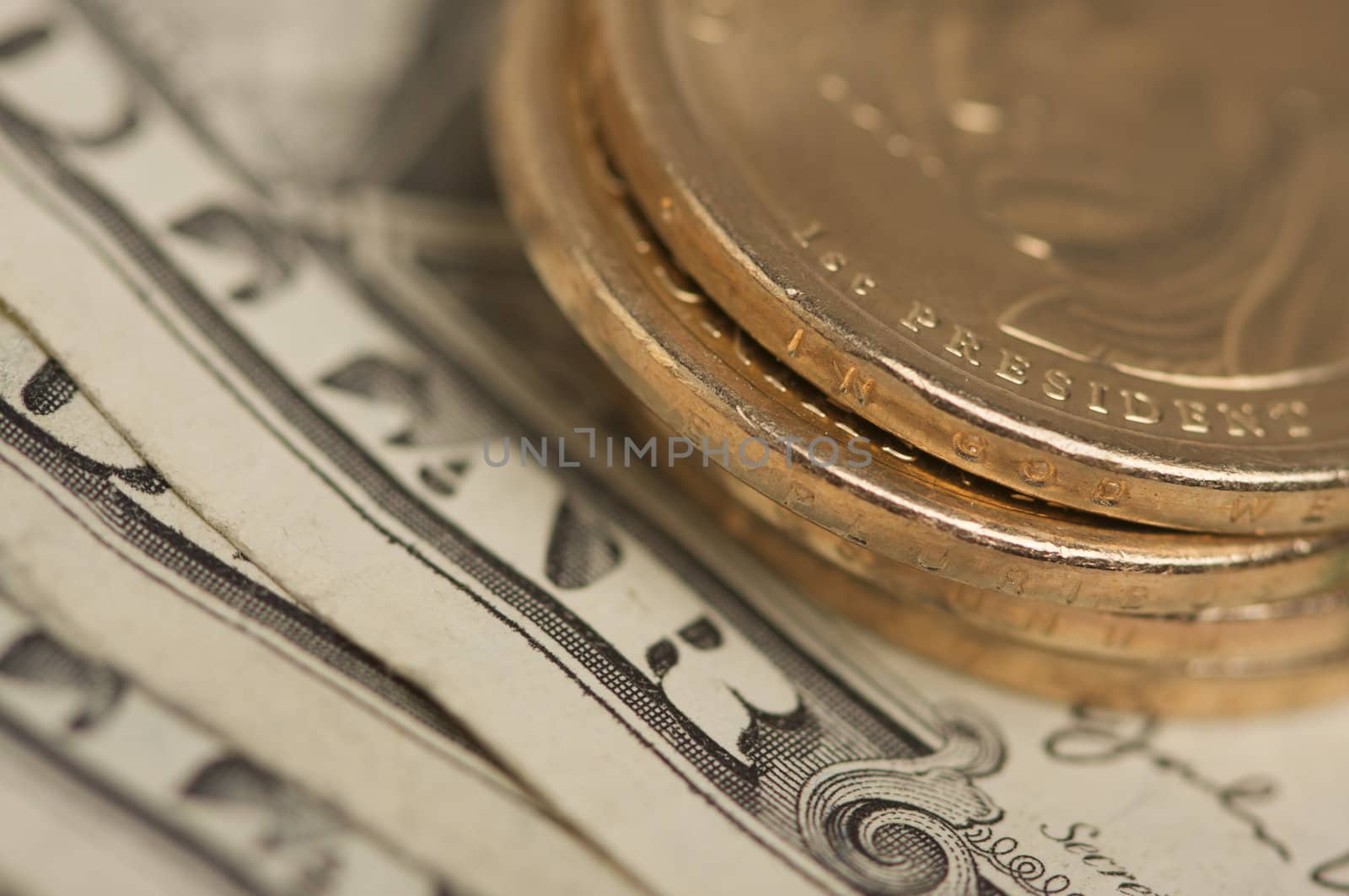 Abstract of the new U.S. Dollar coin on Dollar Bills with Narrow Depth of Field.