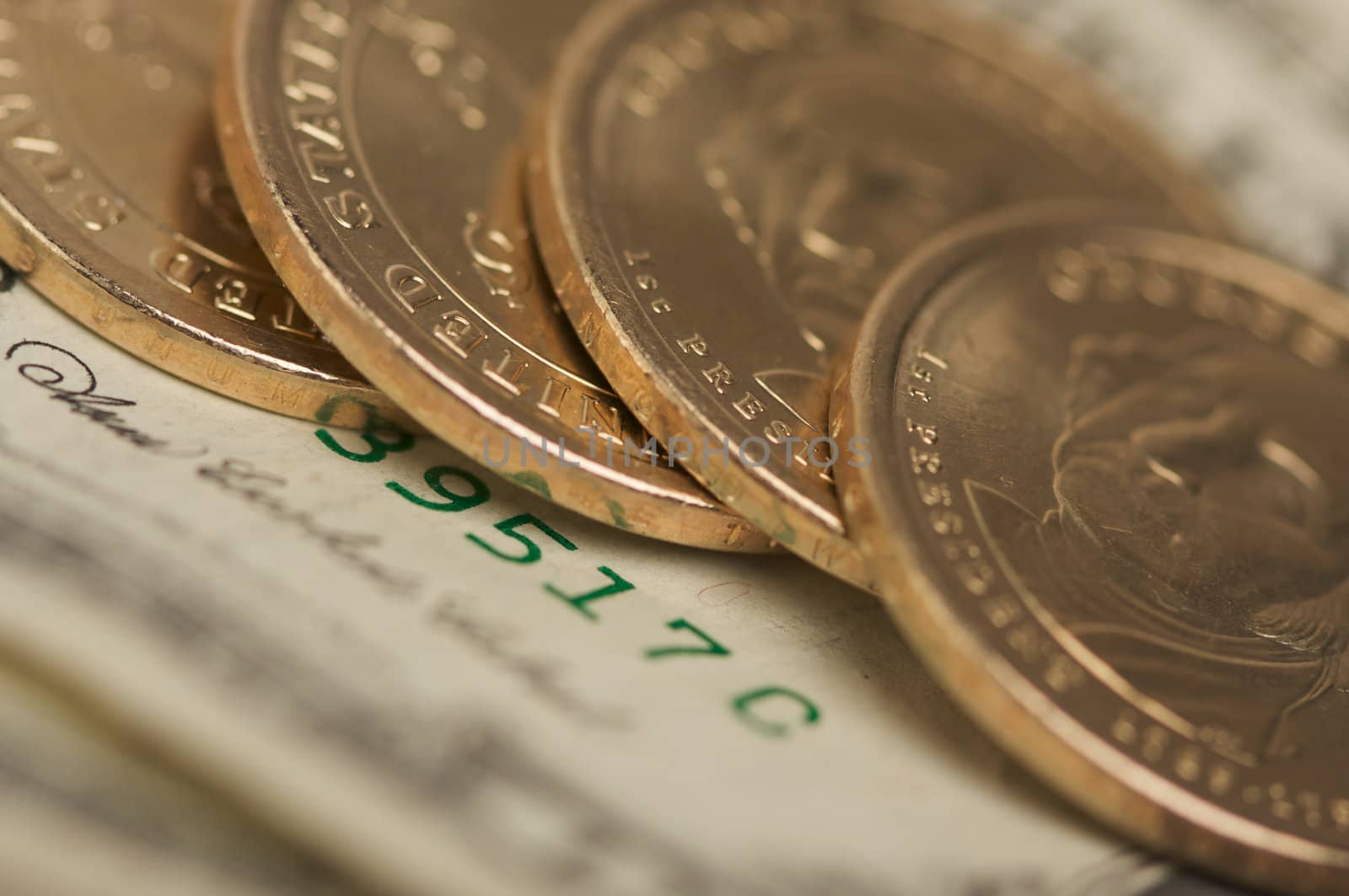 Abstract of the new U.S. Dollar coin on Dollar Bills with Narrow Depth of Field.