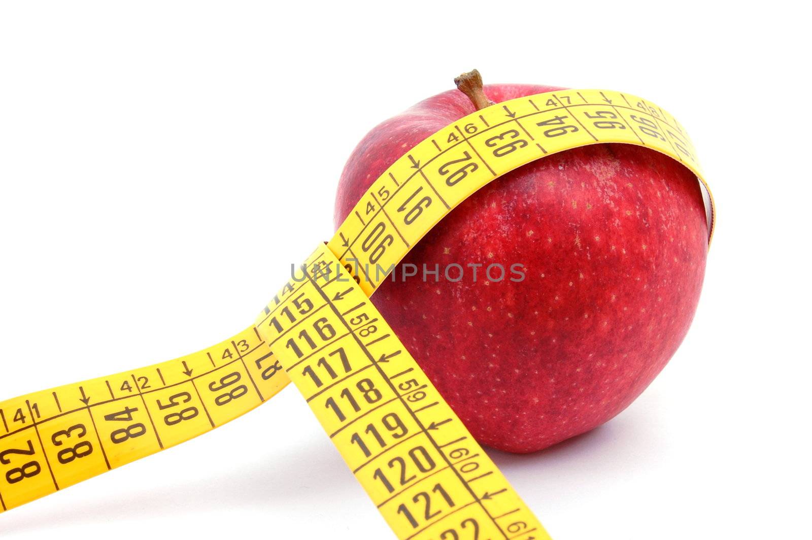 apple and measuring tape isolated on white background
