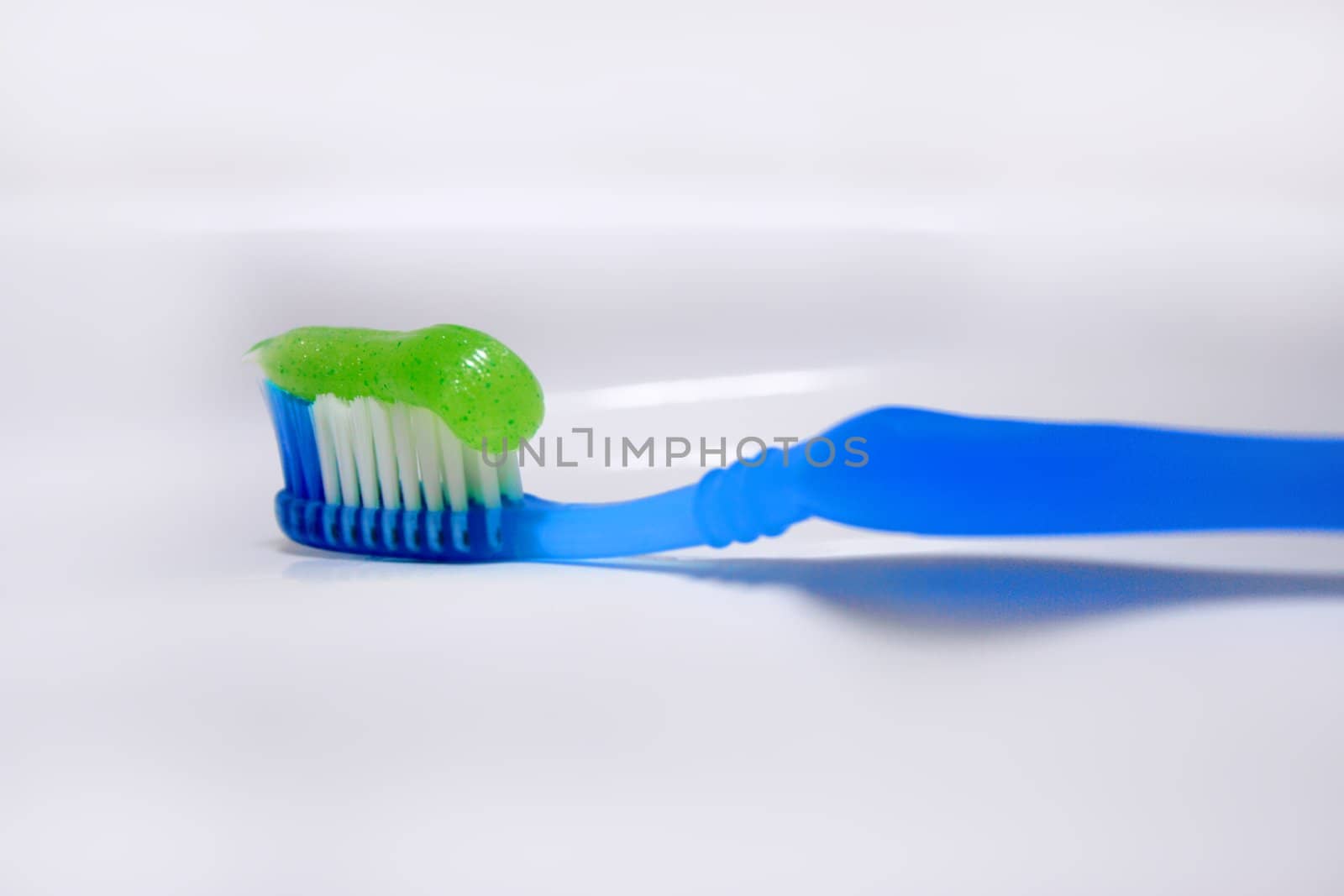 toothbrush and paste background white washstand