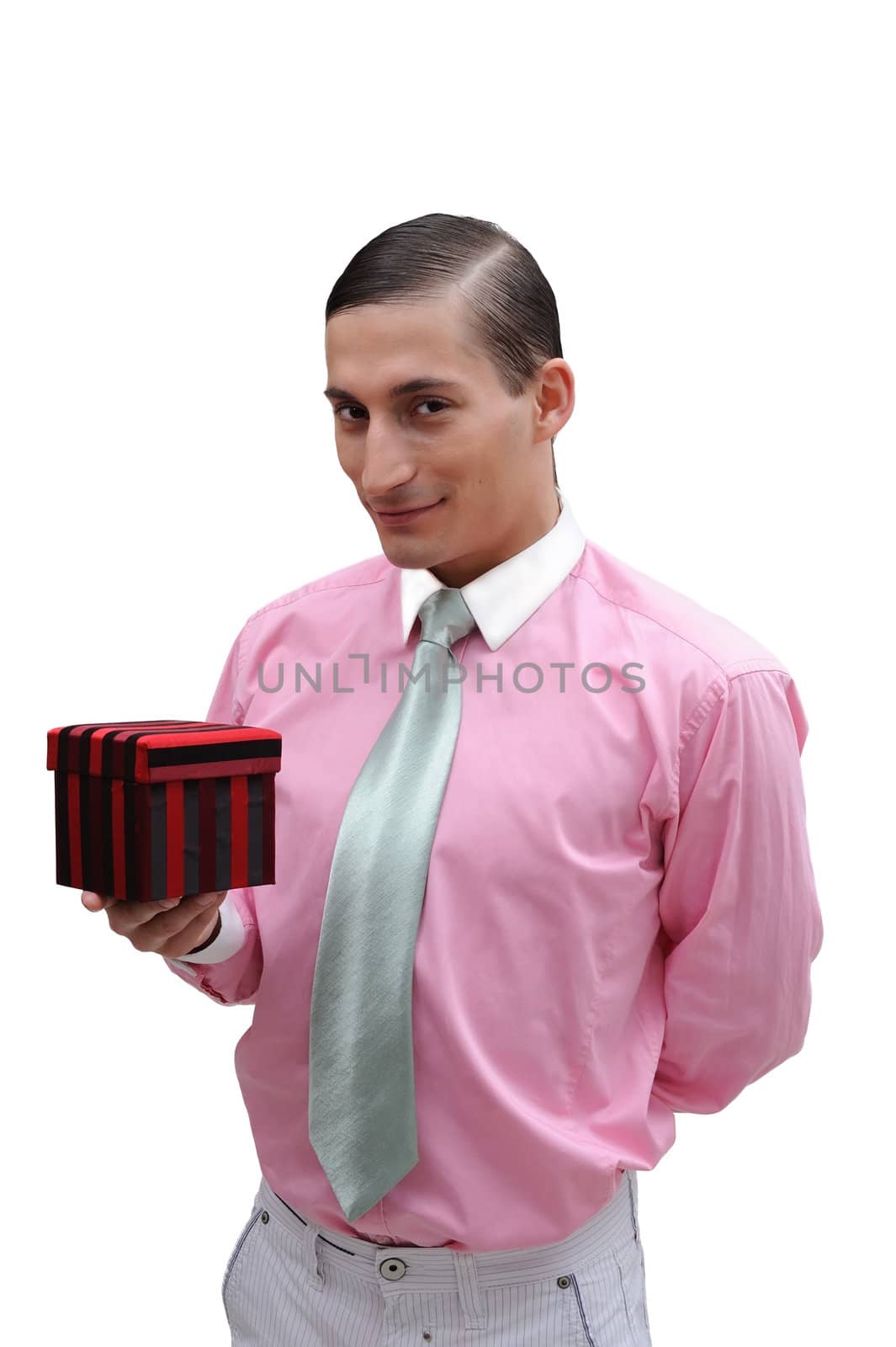 Young handsome confident businessman with red fancy box in hand on white background.
