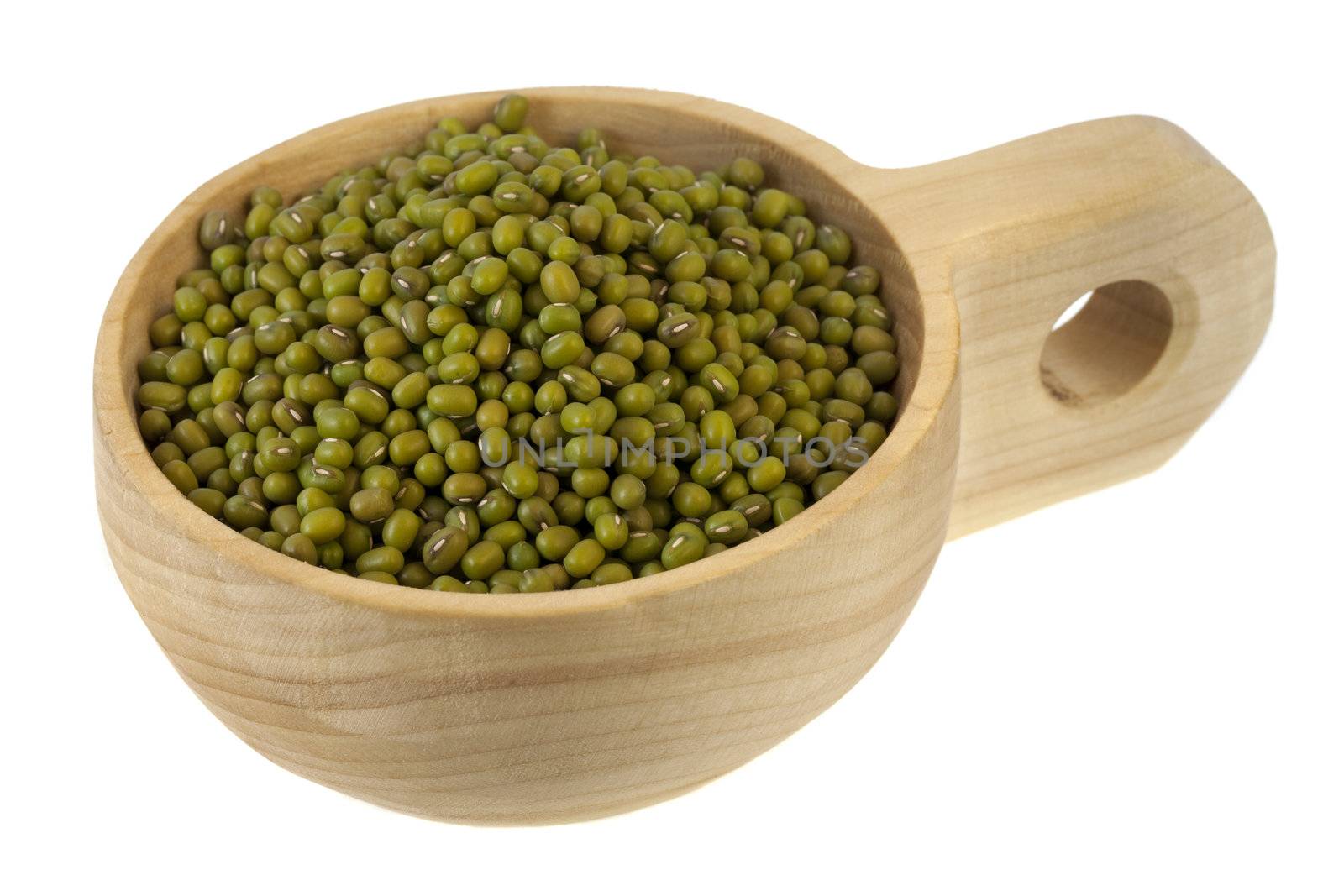 mung beans on a primitive, rustic, wooden scoop (bowl), isolated on white