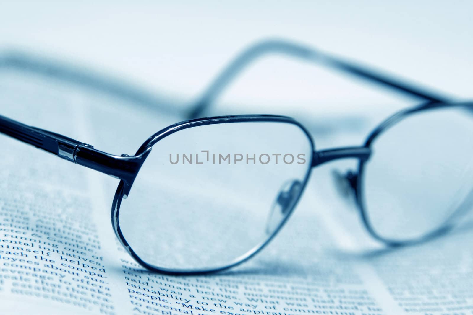 A glasses and the text page