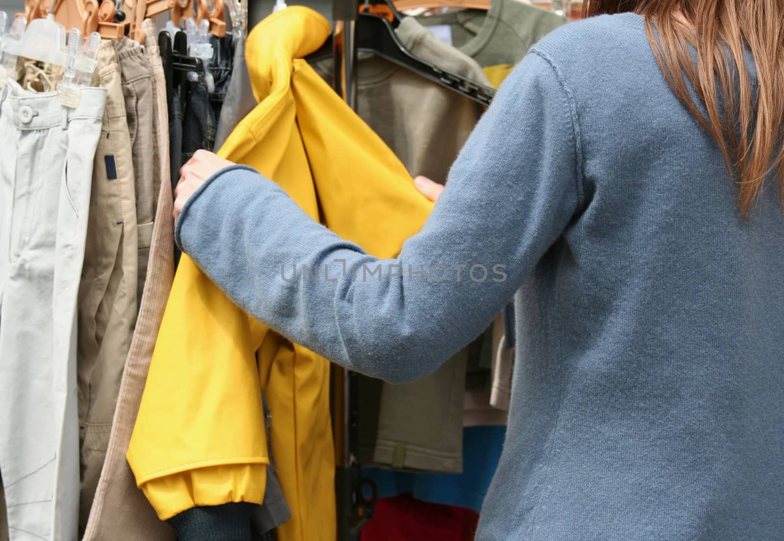 Woman looking at clothes in a shop