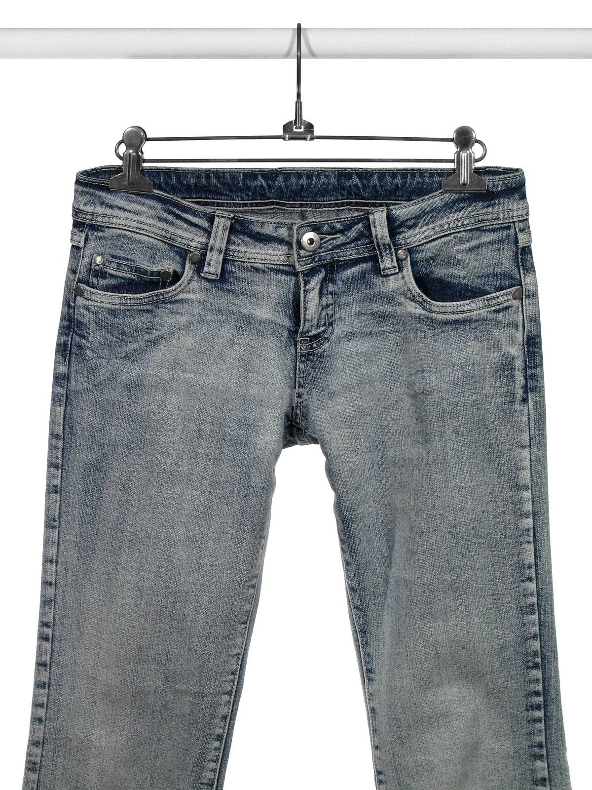 Closeup of blue jeans hanging on a rack. Isolated on white background.
