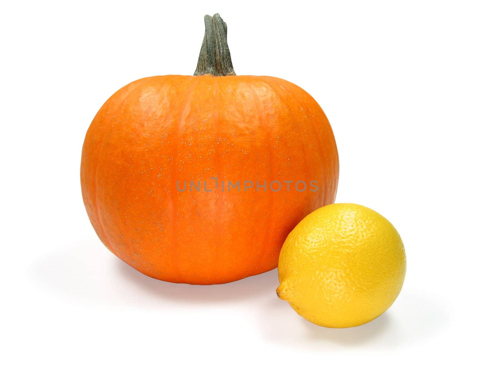 Pumpkin and lemon isolated on white. Contains clipping path.