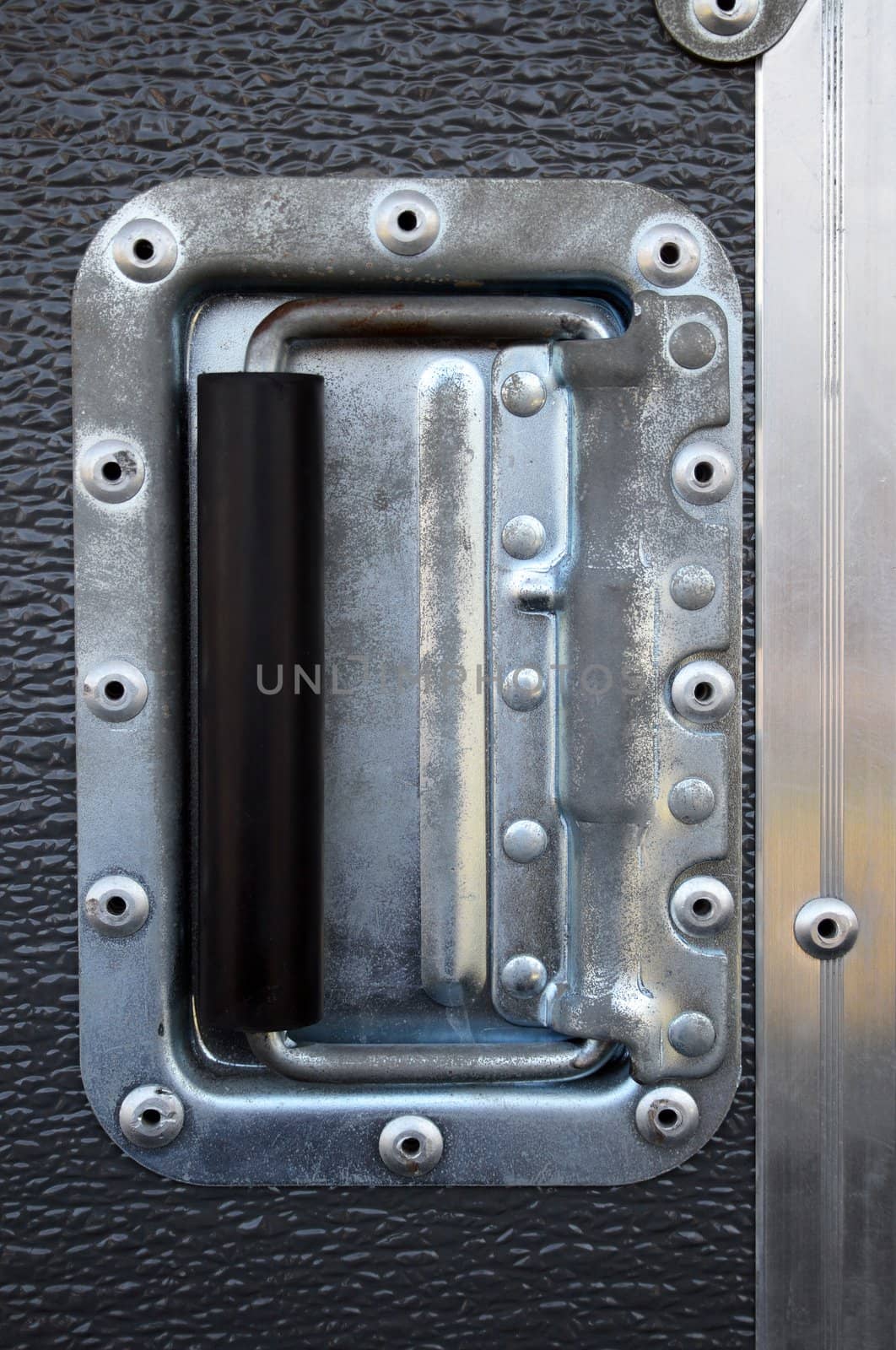 Metallic rivets of a road case (for transporting music and lightning equipment).