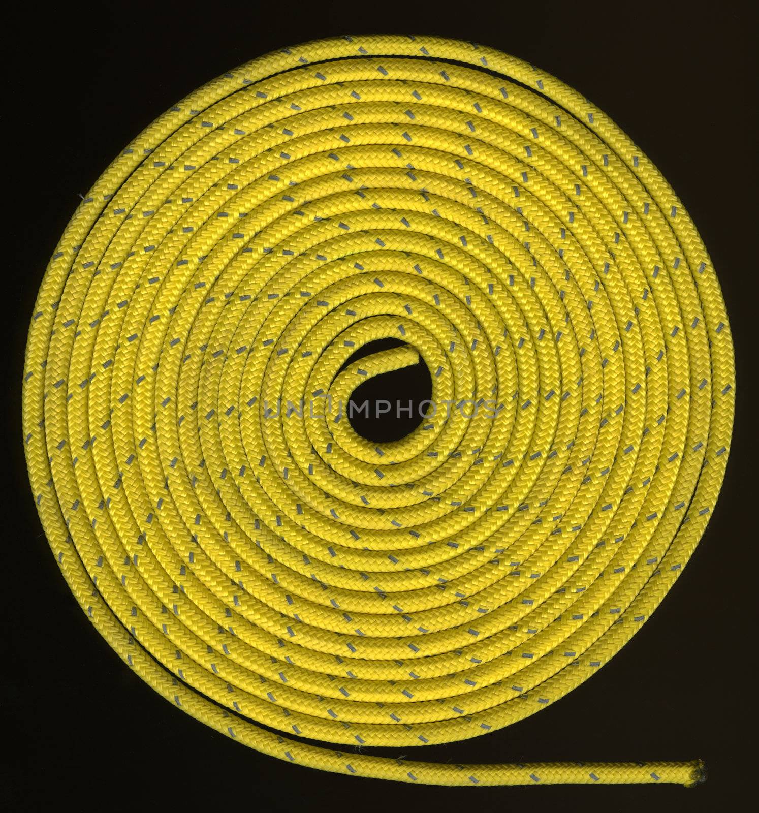 tight coils of yellow, nylon rope with a silver reflective thread on black
