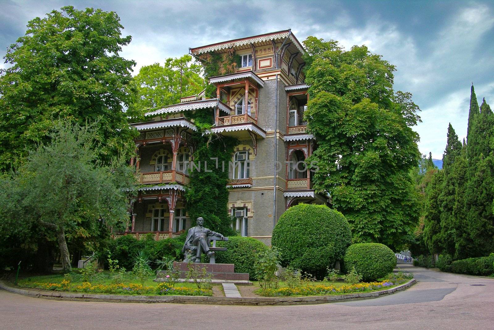Sanatorium building in Gurzuf (Crimea Ukraine). The monument to Lenin is in a foreground.