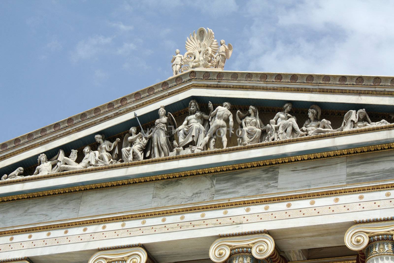 Close up of frieze of Academy of Athens in Greece. This neoclassical building is one of the major landmarks in Athens. This multiple-figured composition represents the birth of Athena with Zeus in the middle, Athena on his right and Hefestos on his left.