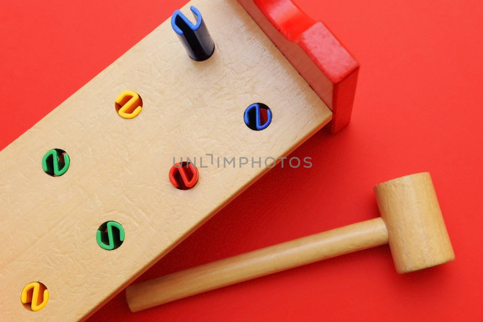 Colorful wooden toy with hammer 