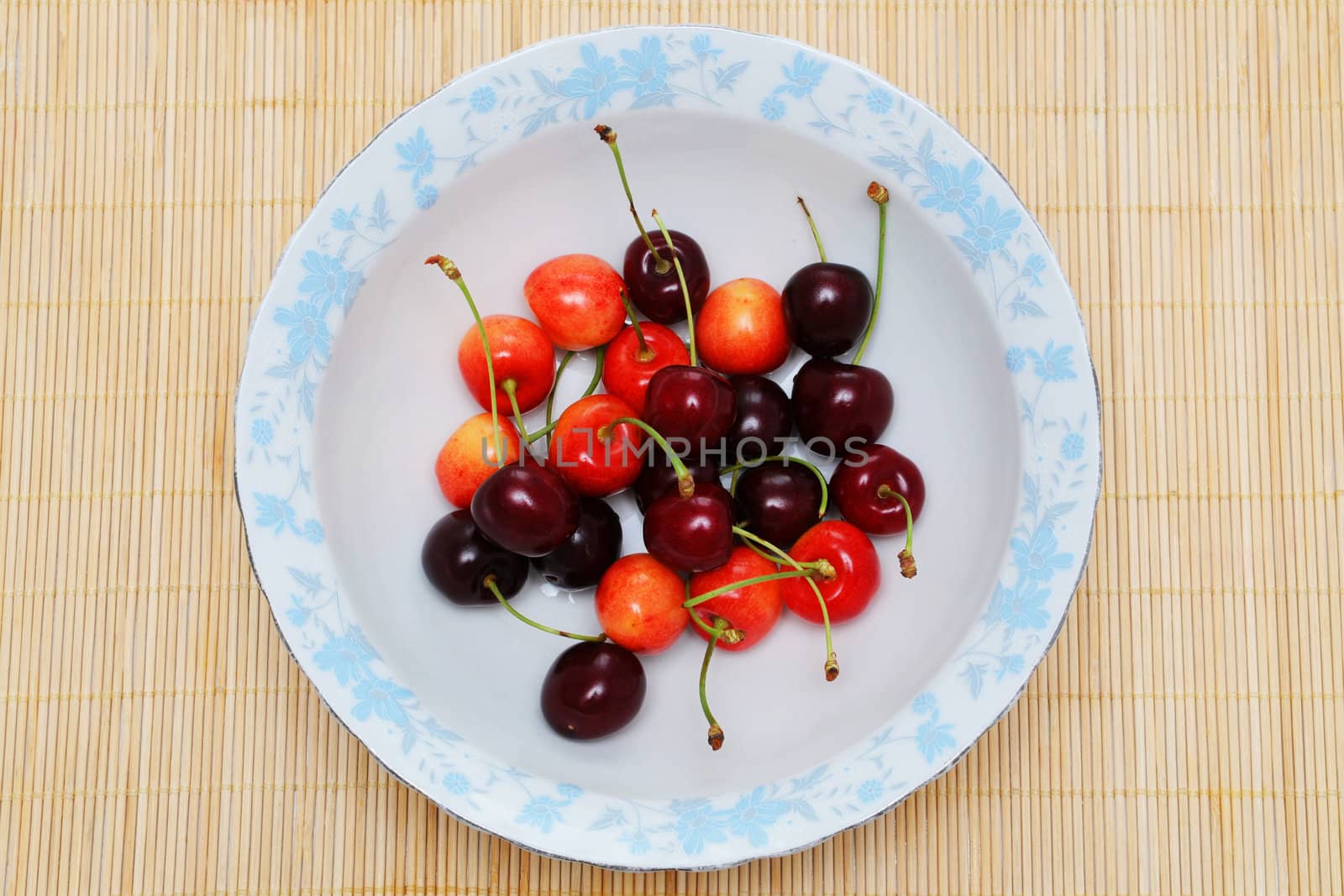 Sweet cherries on the plate