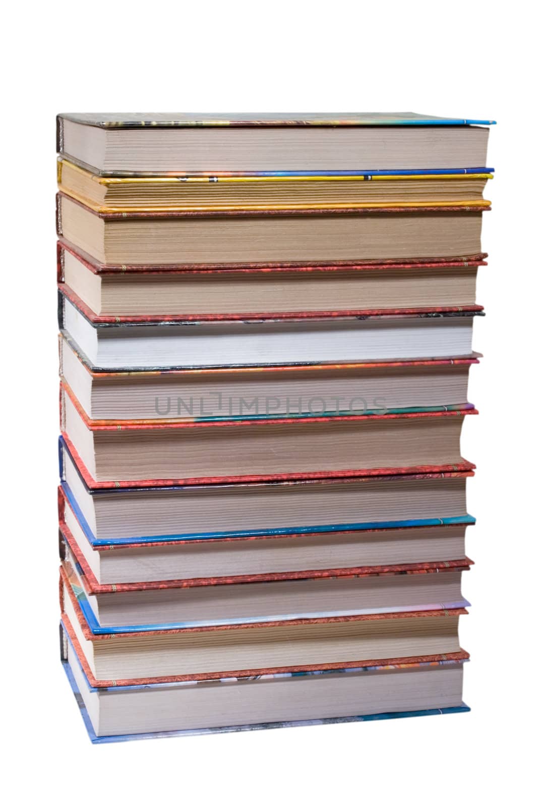 dozen different books, stacked on a white background
