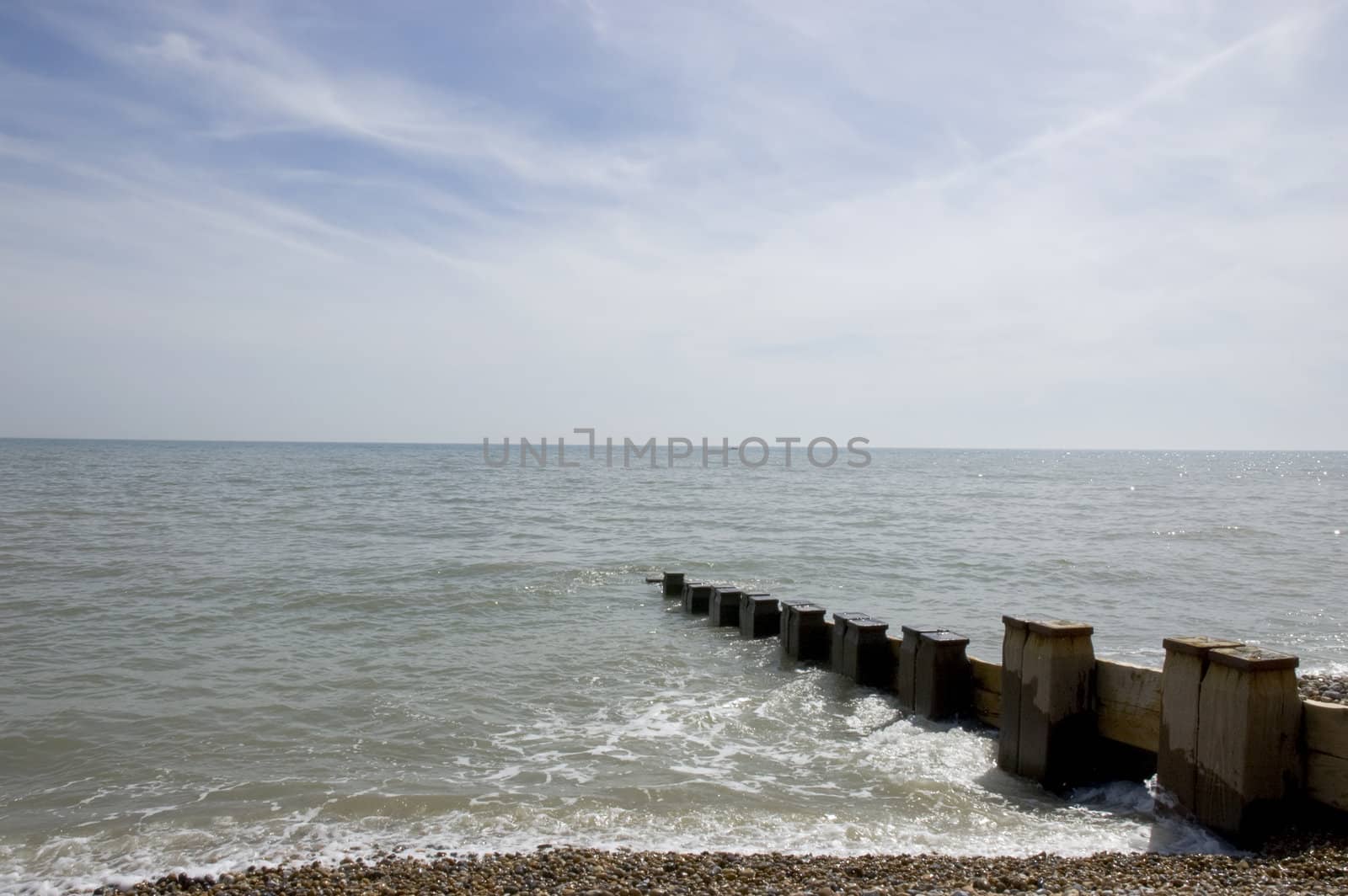 Groyne leading into the sea on a cold day