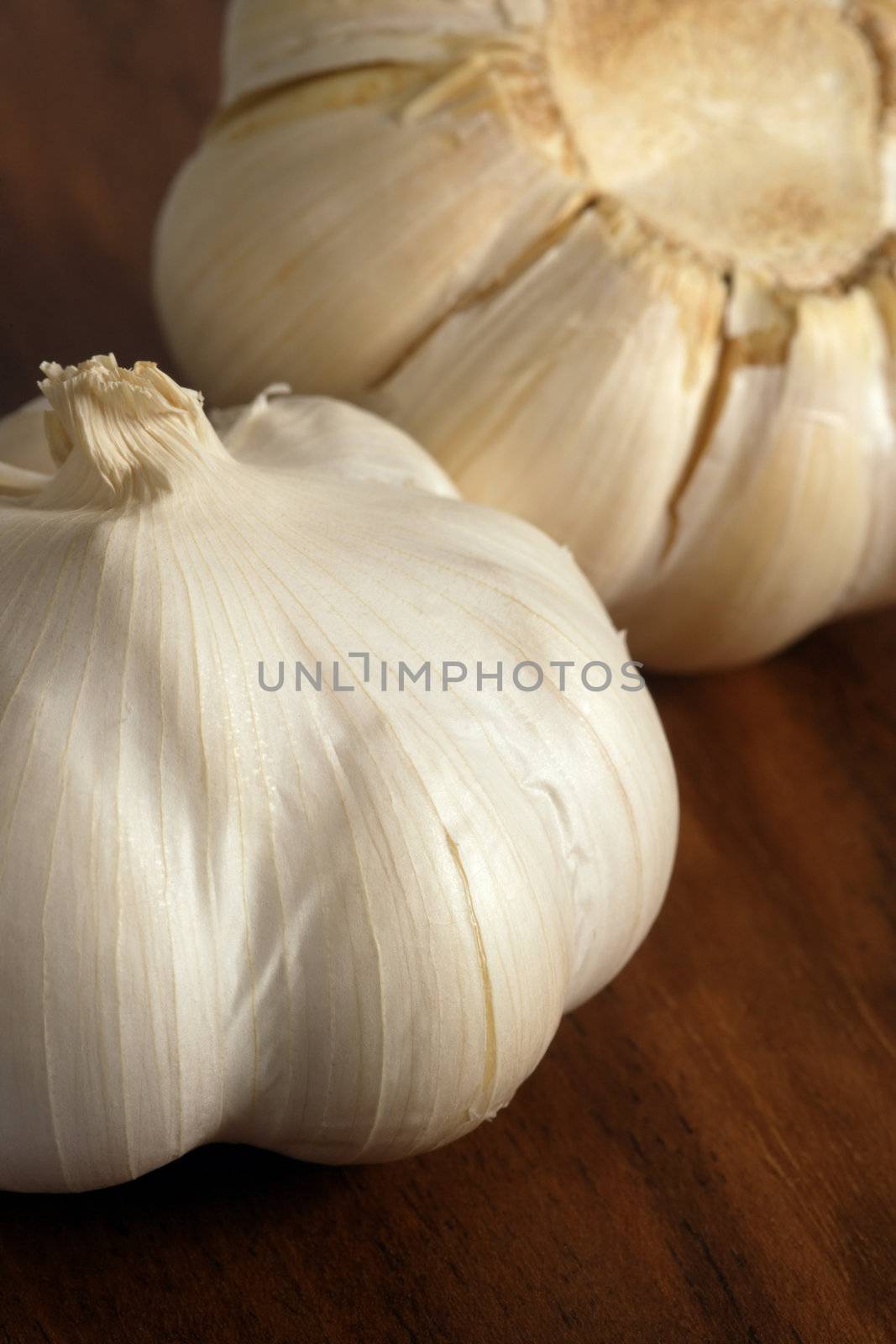 Cloves of garlic on a wood cutting board
