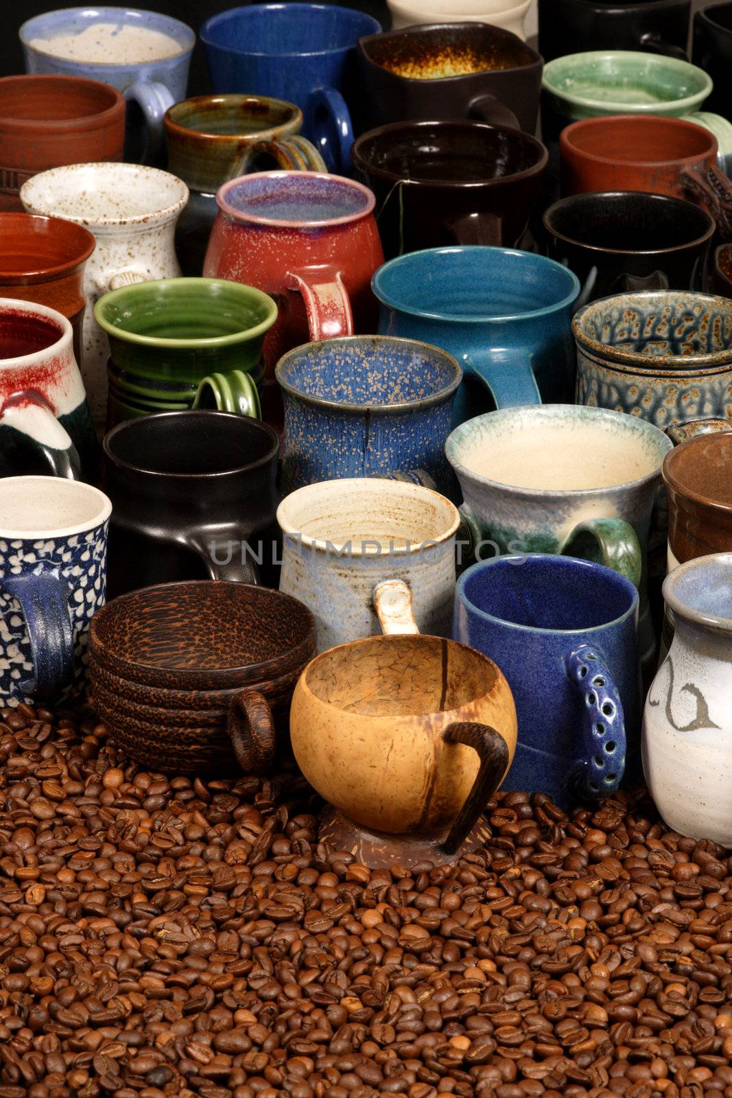 A collection of ceramic coffee mugs filled with different coffee - background image for coffee establishments.
