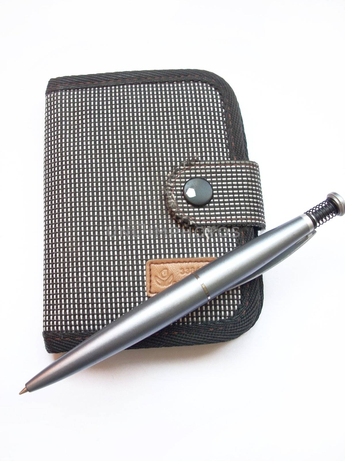 A photograph of ballpoint and writing-pad
