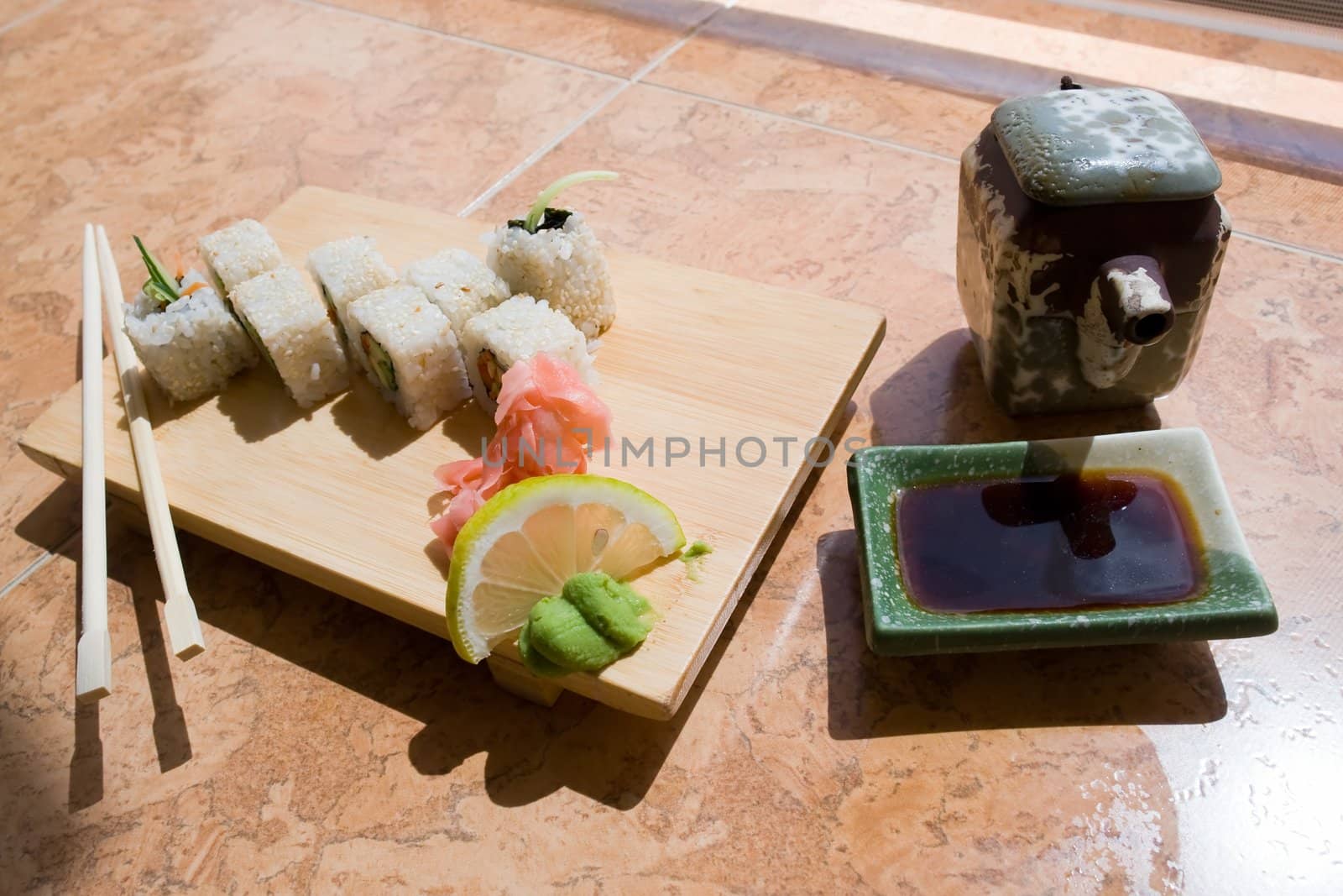 japanese sushi. Traditional wooden plate and chopsticks.