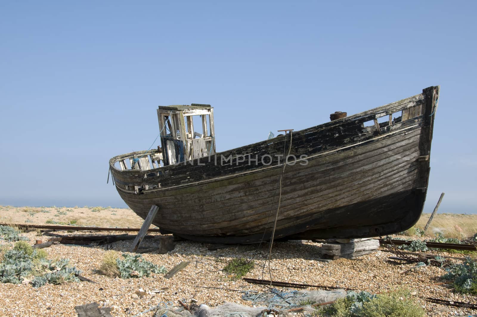 An old fishing boat on the beach at Dungeness