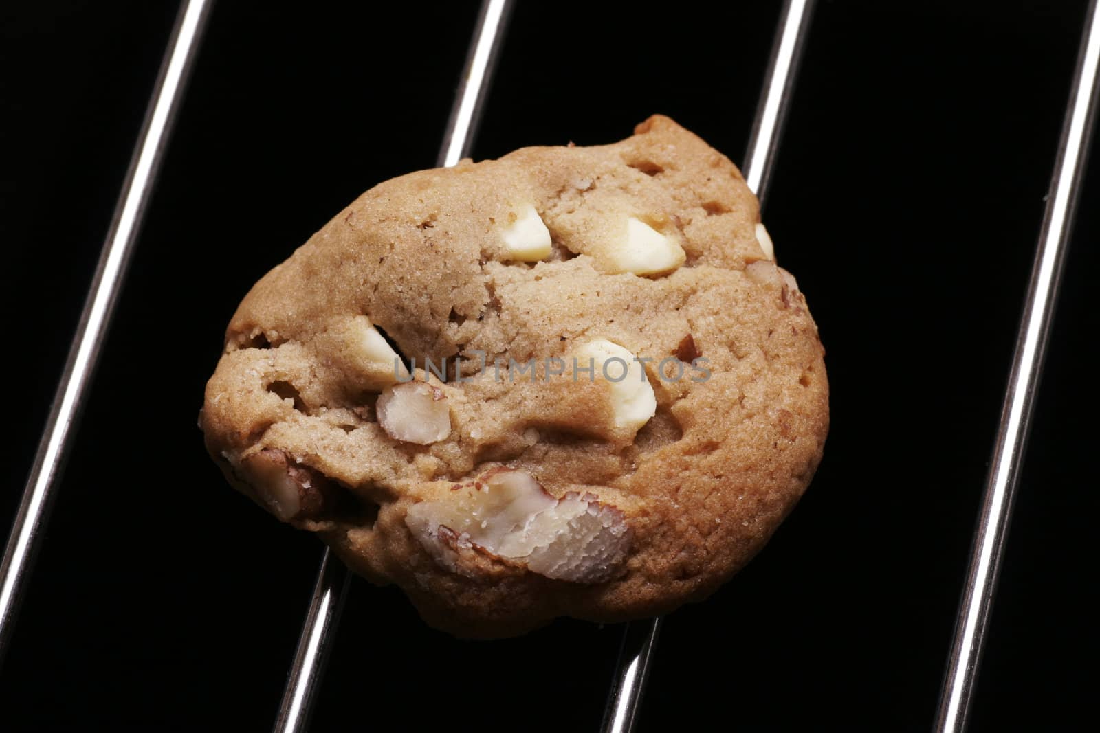 Cookie Biscuit With White Chocolate And Nuts On Oven Rack