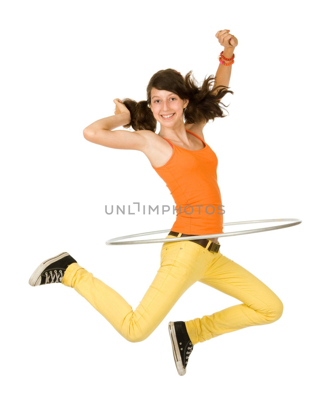 Joyful teenager girl with hula hoop on white background
