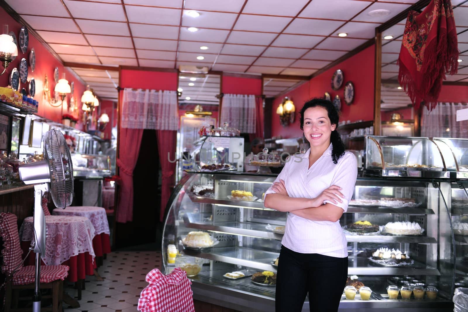 proud and confident owner of a small pastry store 