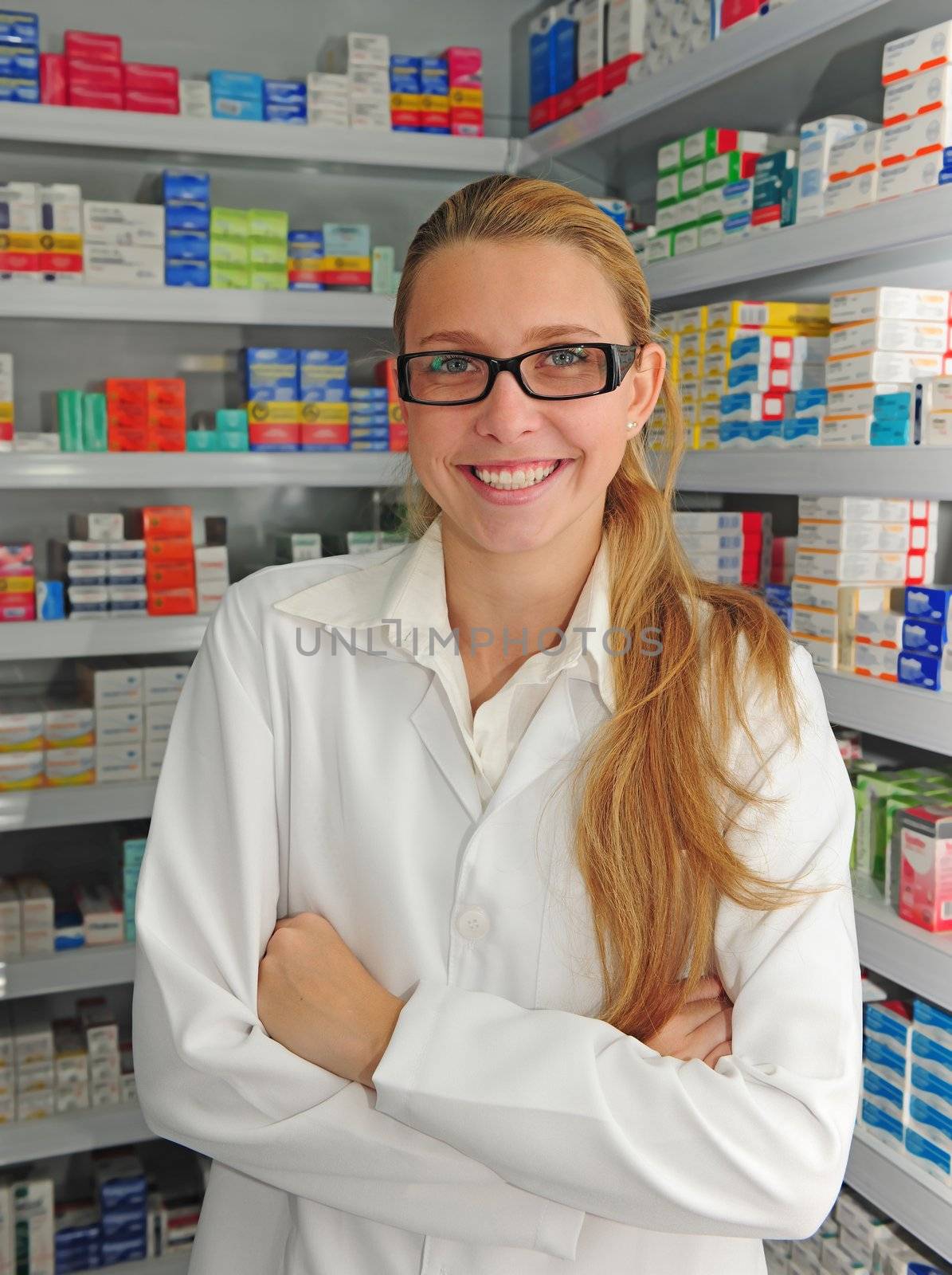 portrait of a female pharmacist at pharmacy