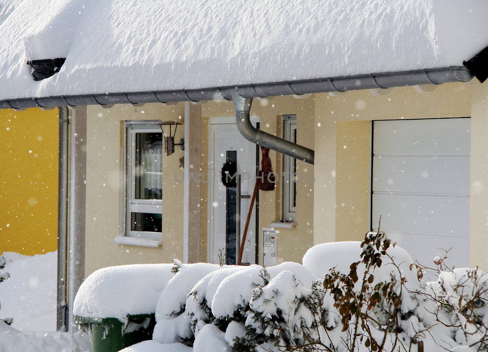 New house in the winter with snowflakes