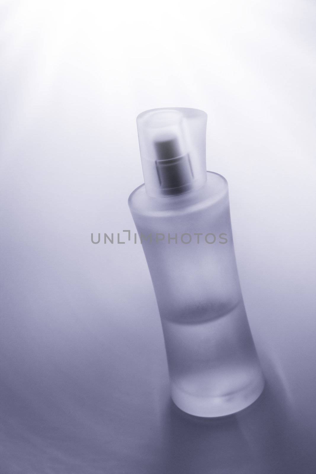 bottle of parfume in front of nice background