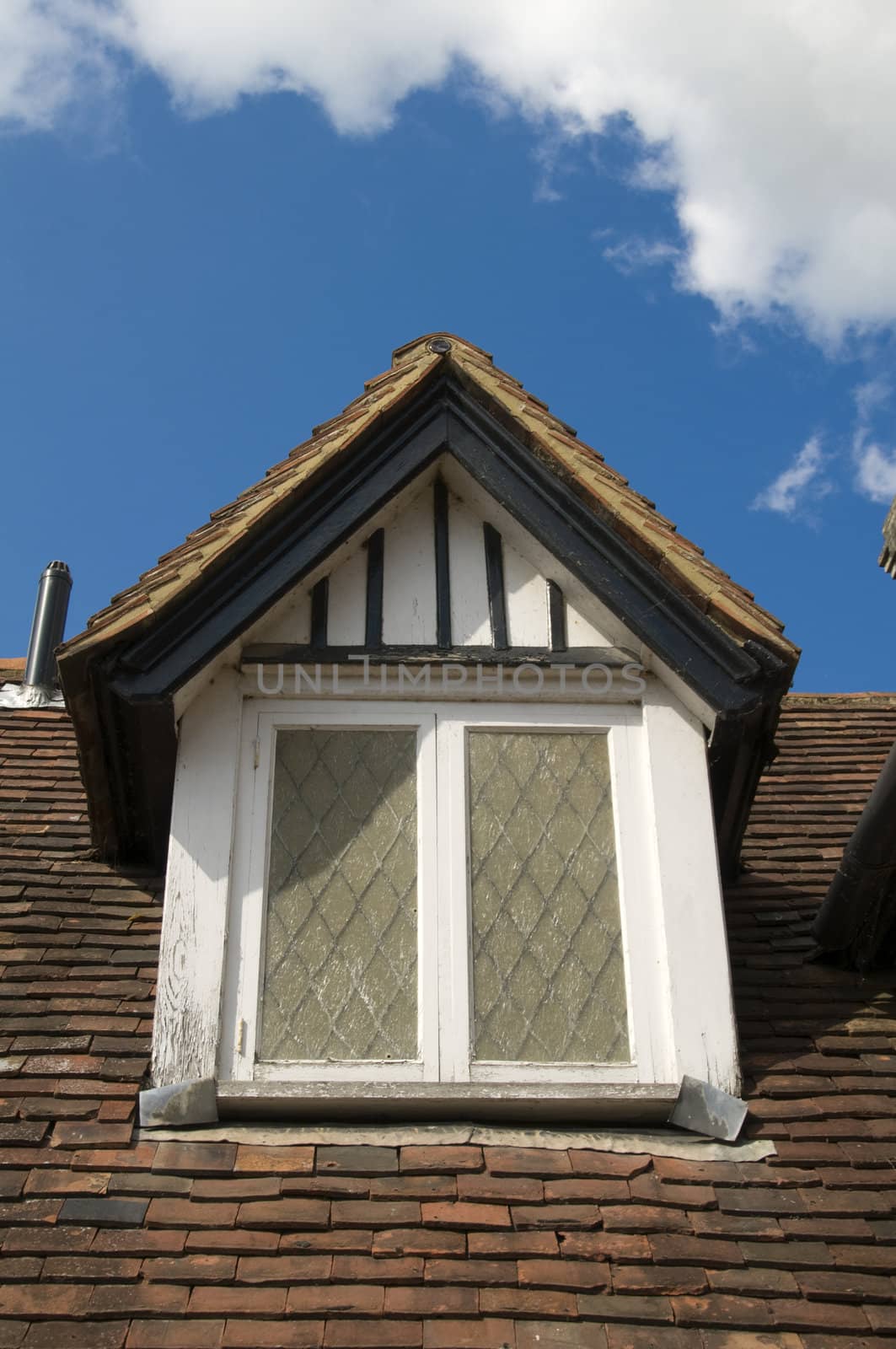 A dormer window on an old house