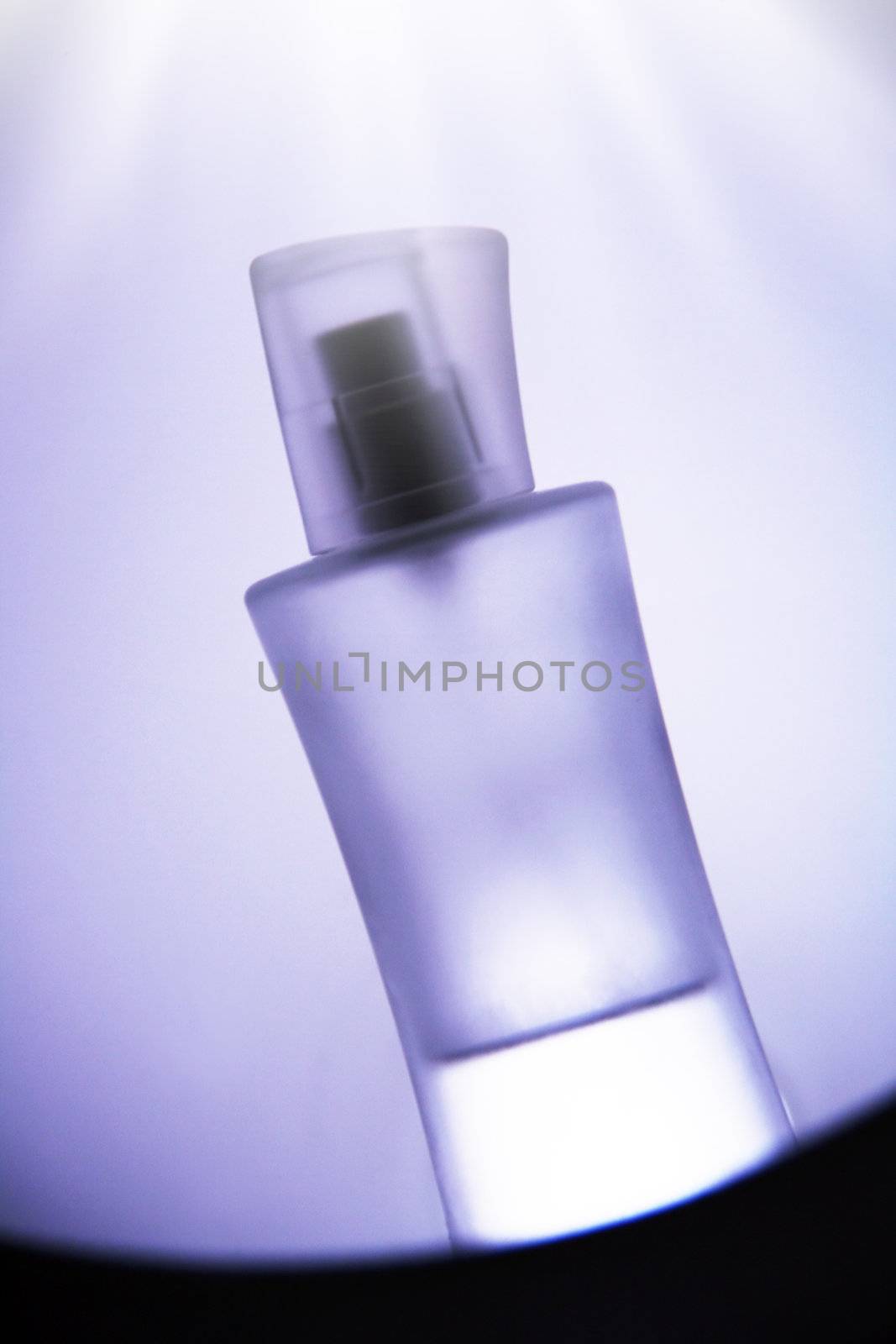 bottle of parfume in front of nice background