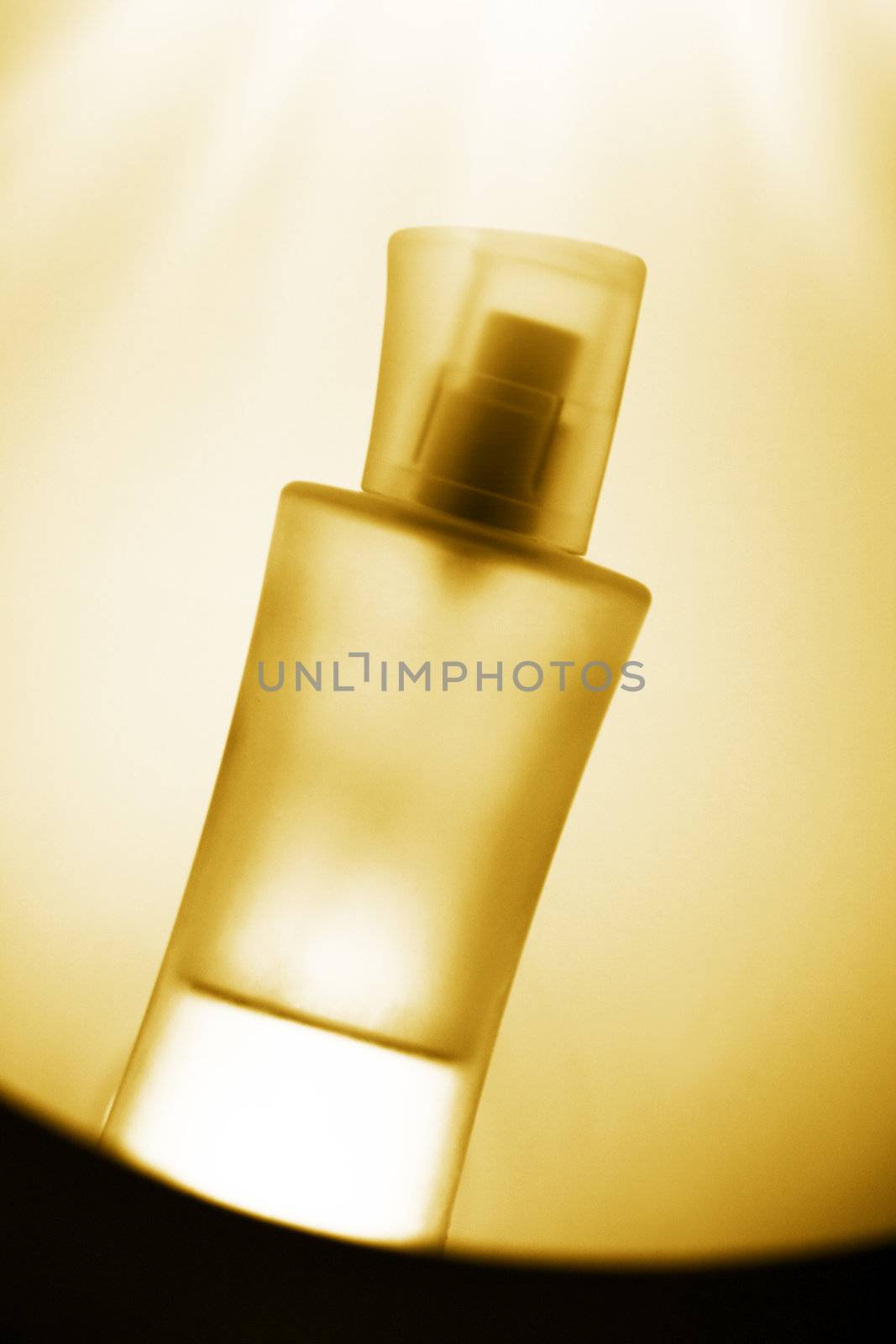 bottle of parfume in front of nice background