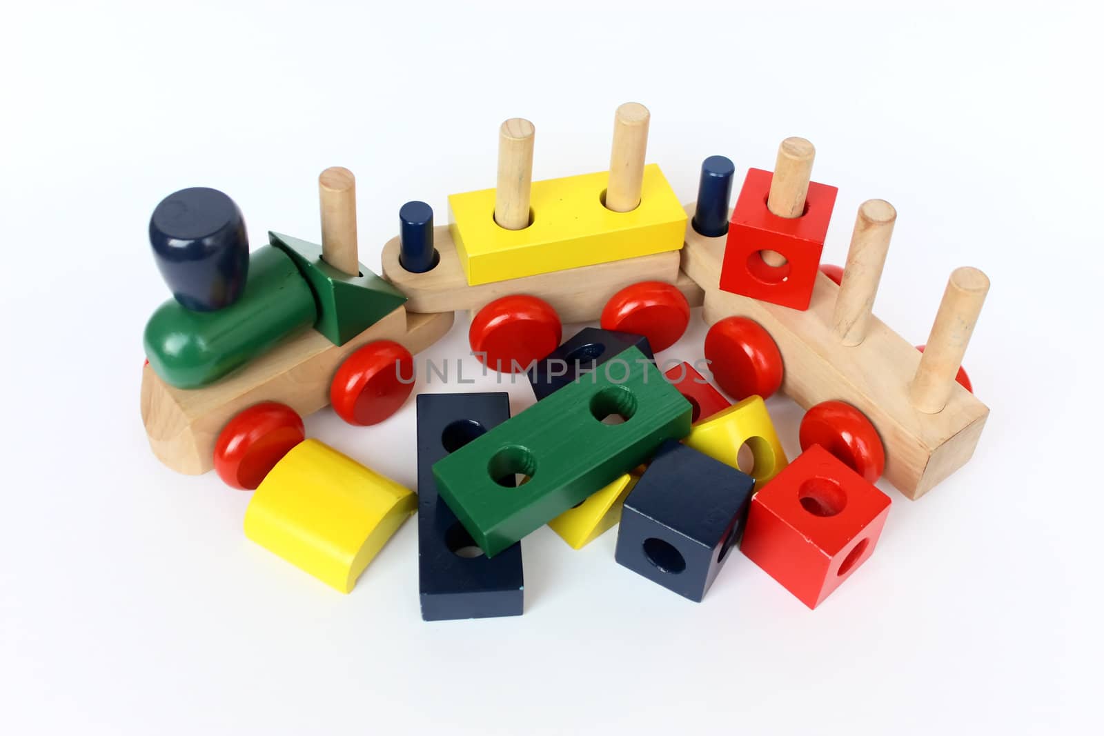a colorful wooden train toy for children on white paper