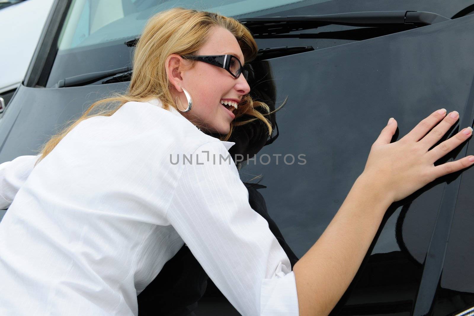 woman is really happy with her new car