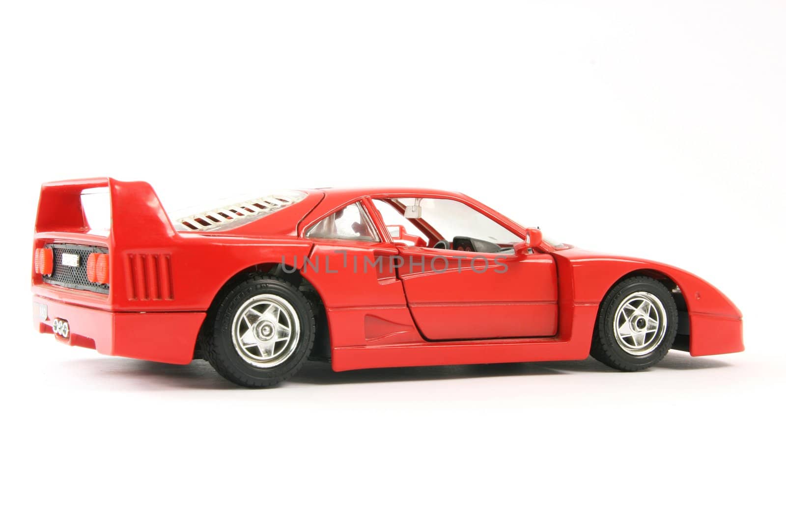 red sports car miniature isolated on white background
