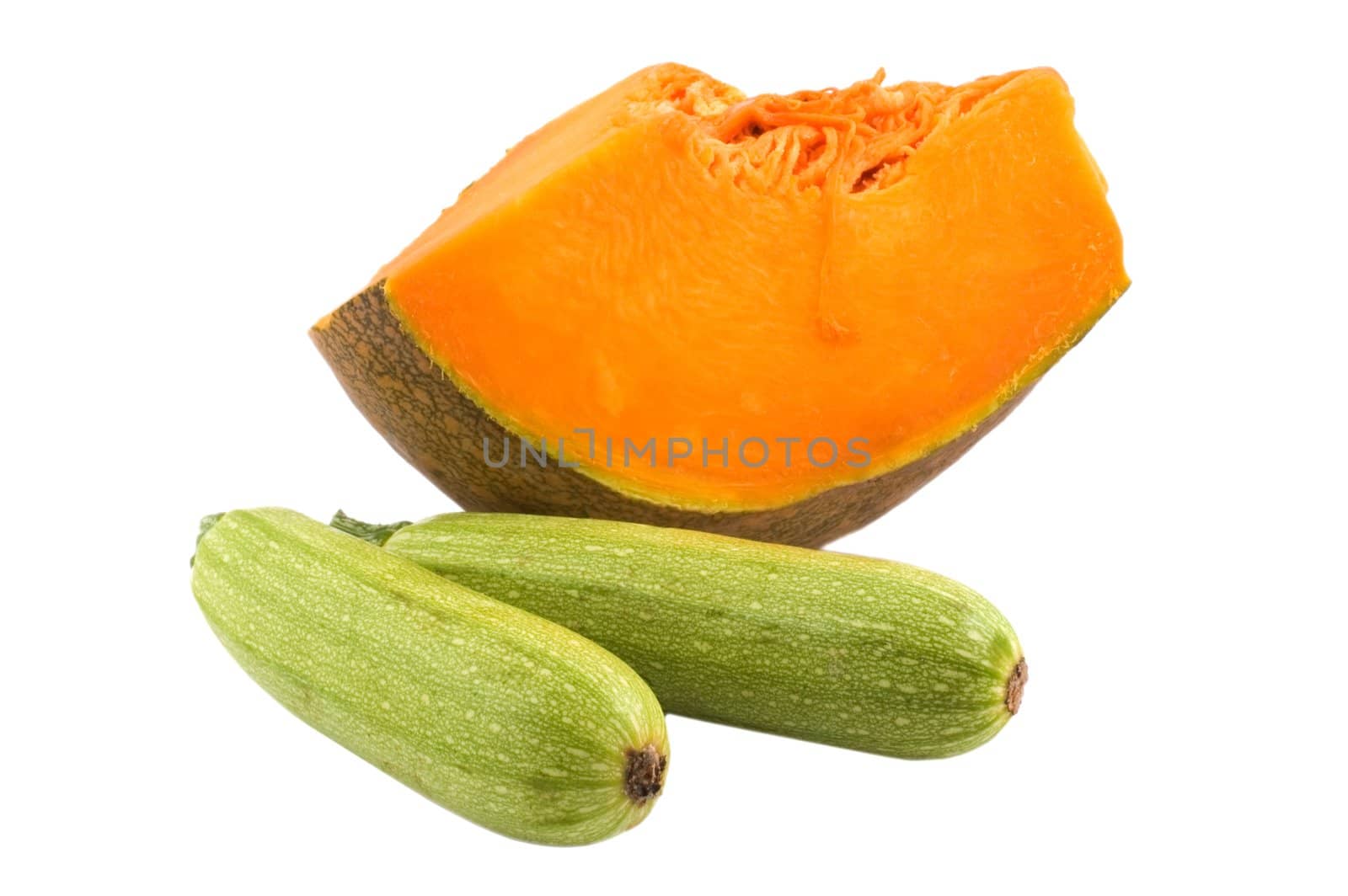 Two zucchini and a slice of pumpkin isolated on white