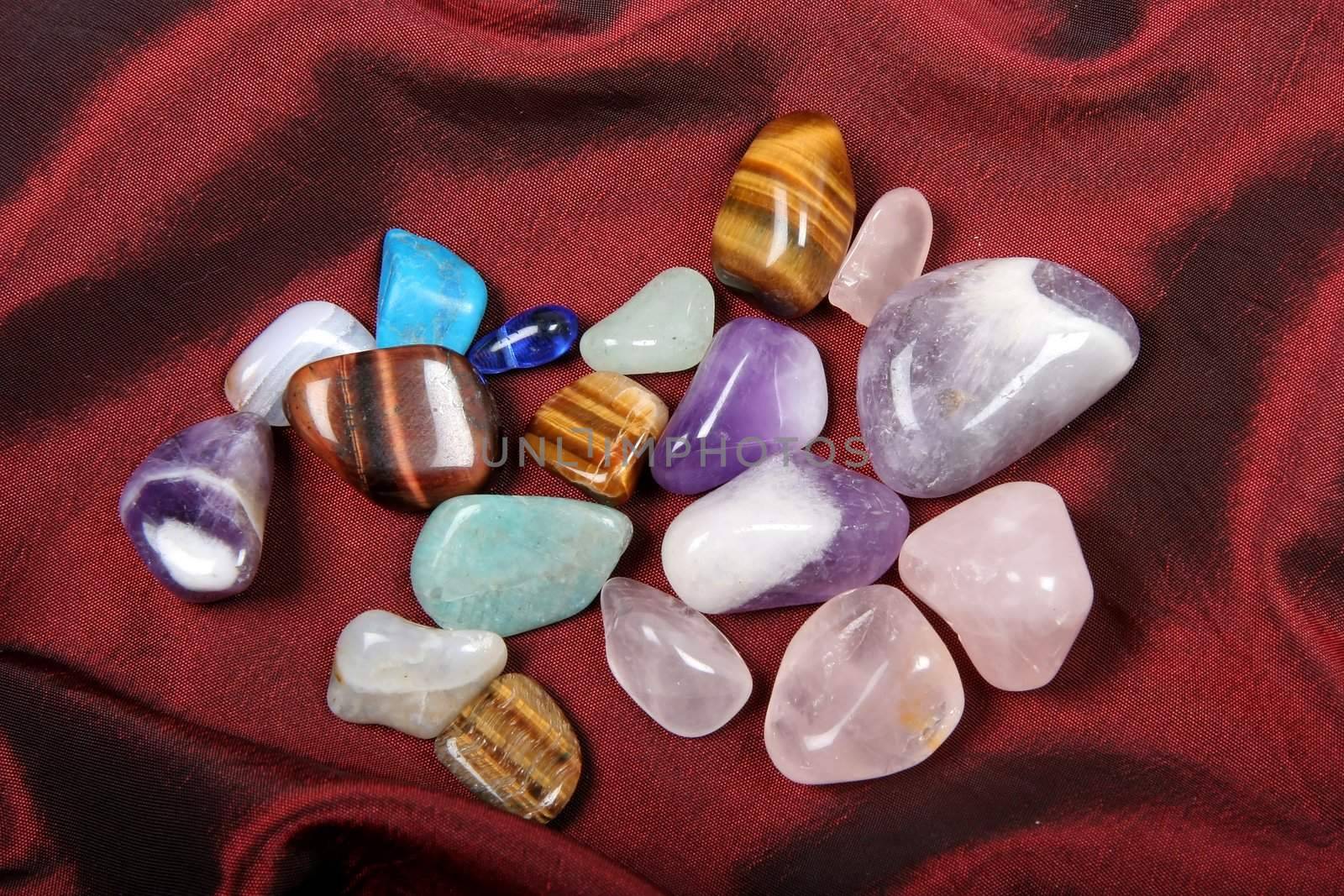 Polished Semi Precious Stones on a red cloth background