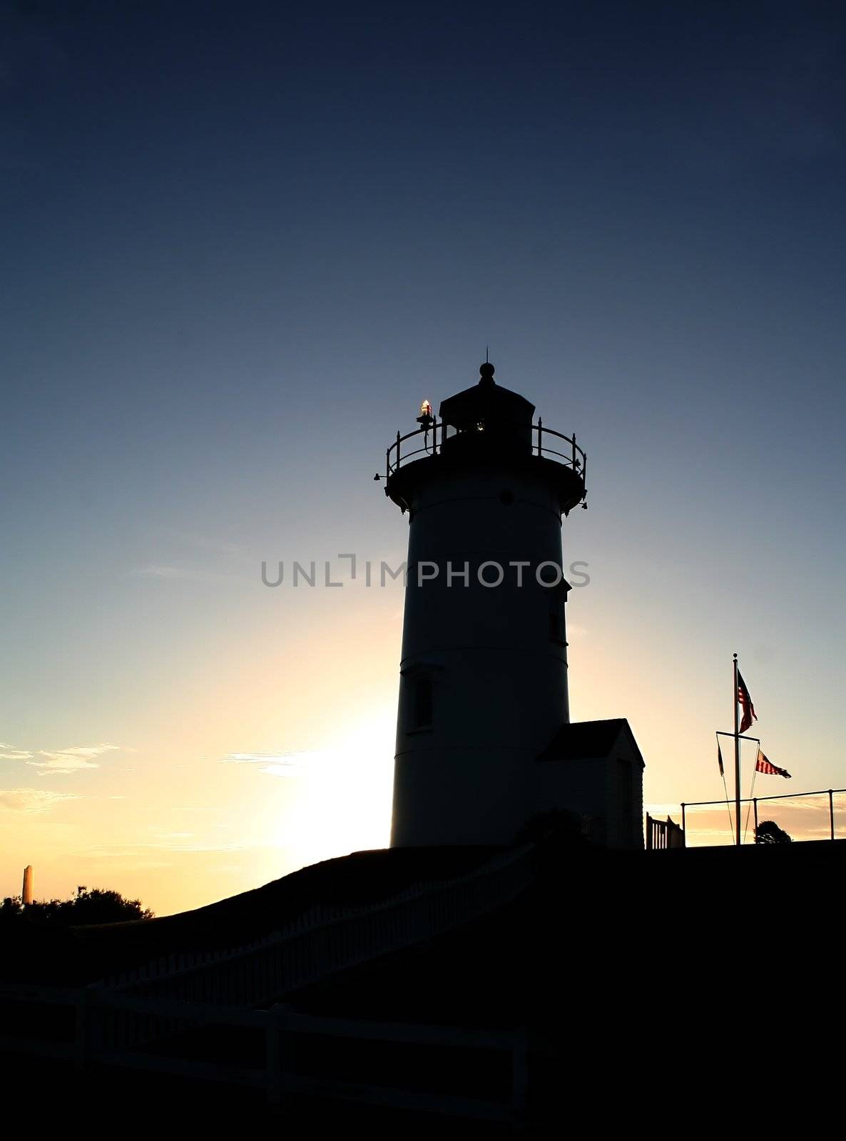 Nobska Lighthouse silhouetted by the setting sun
