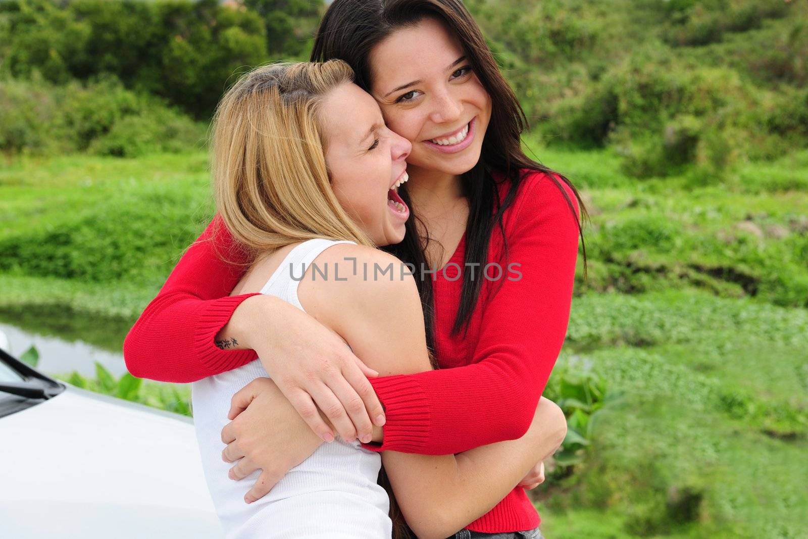 two happy women on car trip