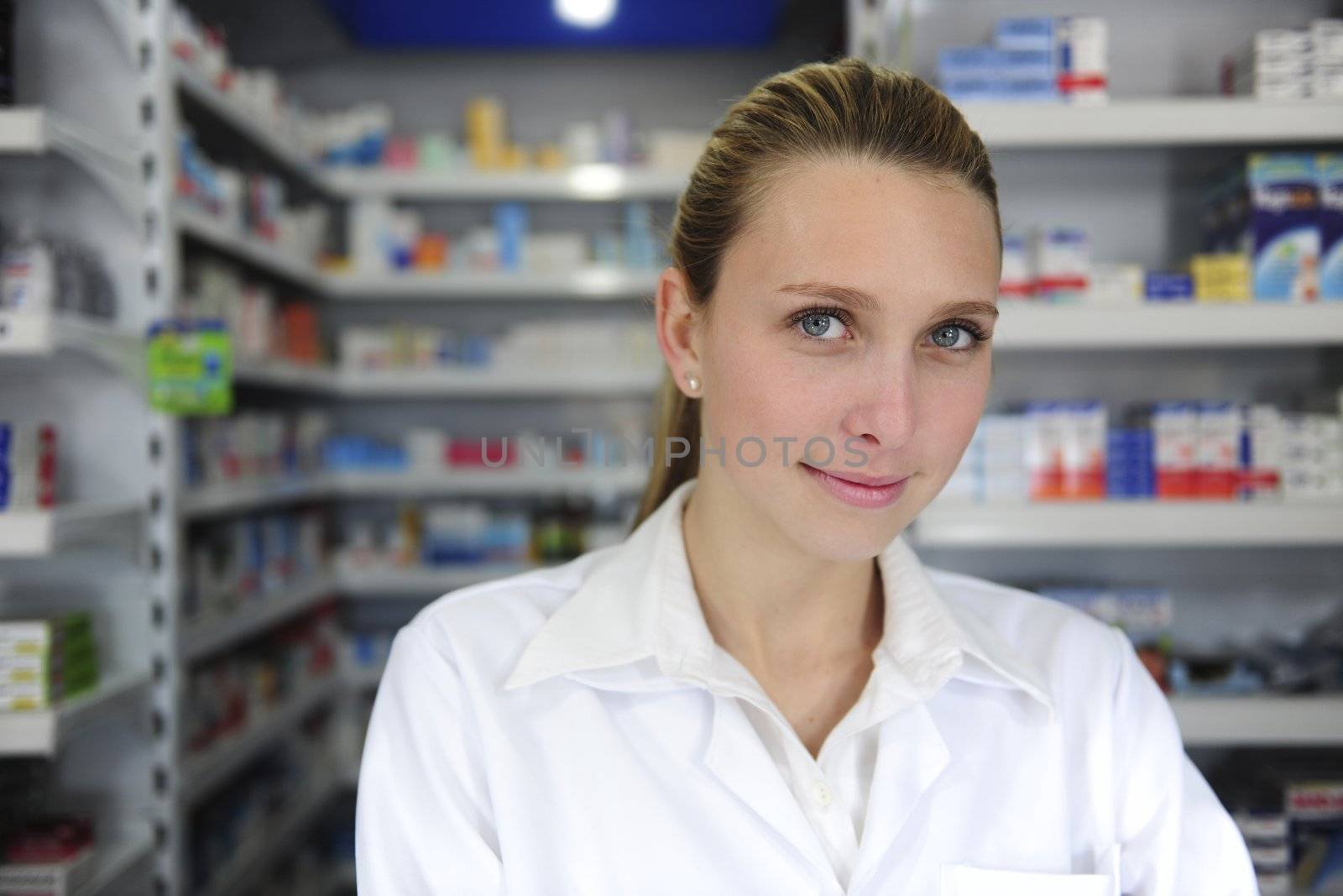 portrait of a female pharmacist at pharmacy