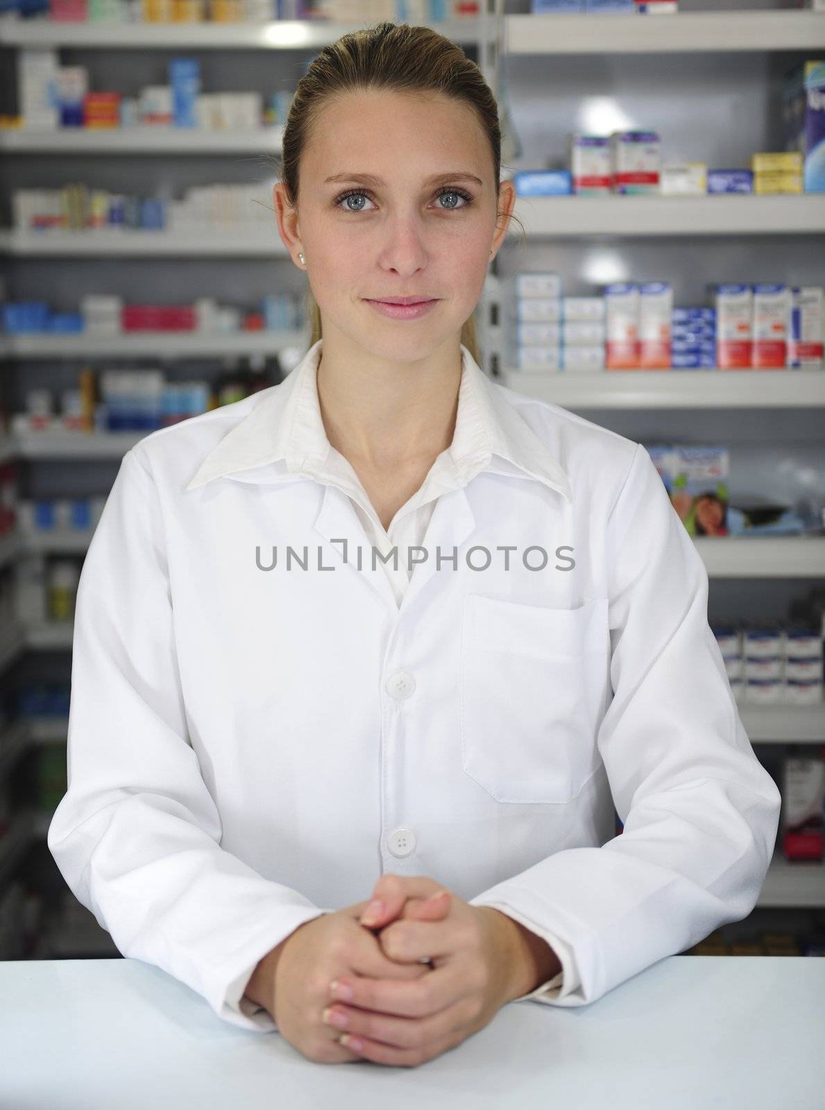 portrait of a female pharmacist at pharmacy