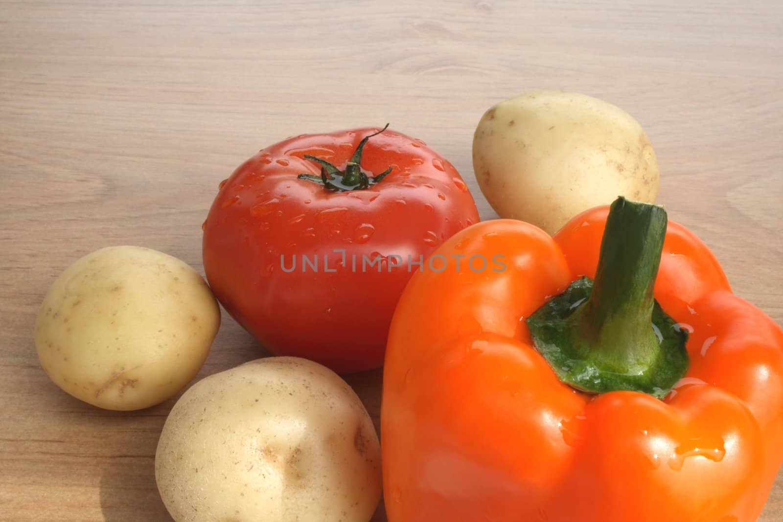 Sweet orange pepper, tomato and potatoes. Fresh vegetables - healthy food.
