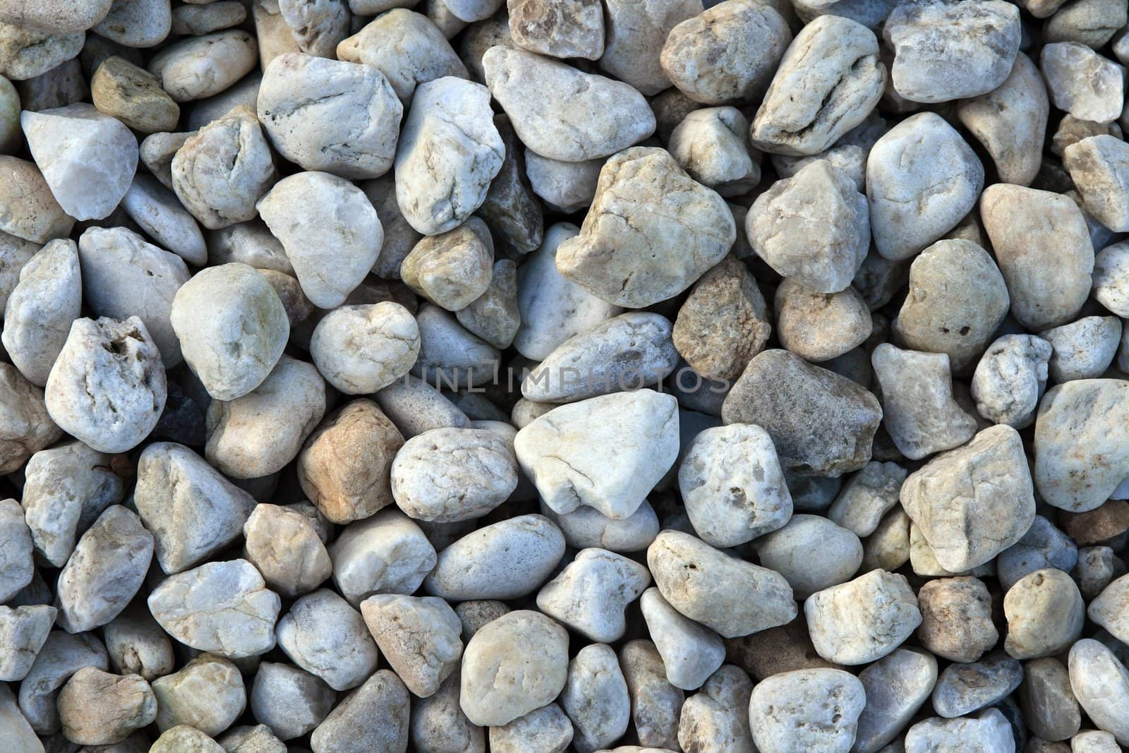 Pebble rocks in pastel colors, natural background.