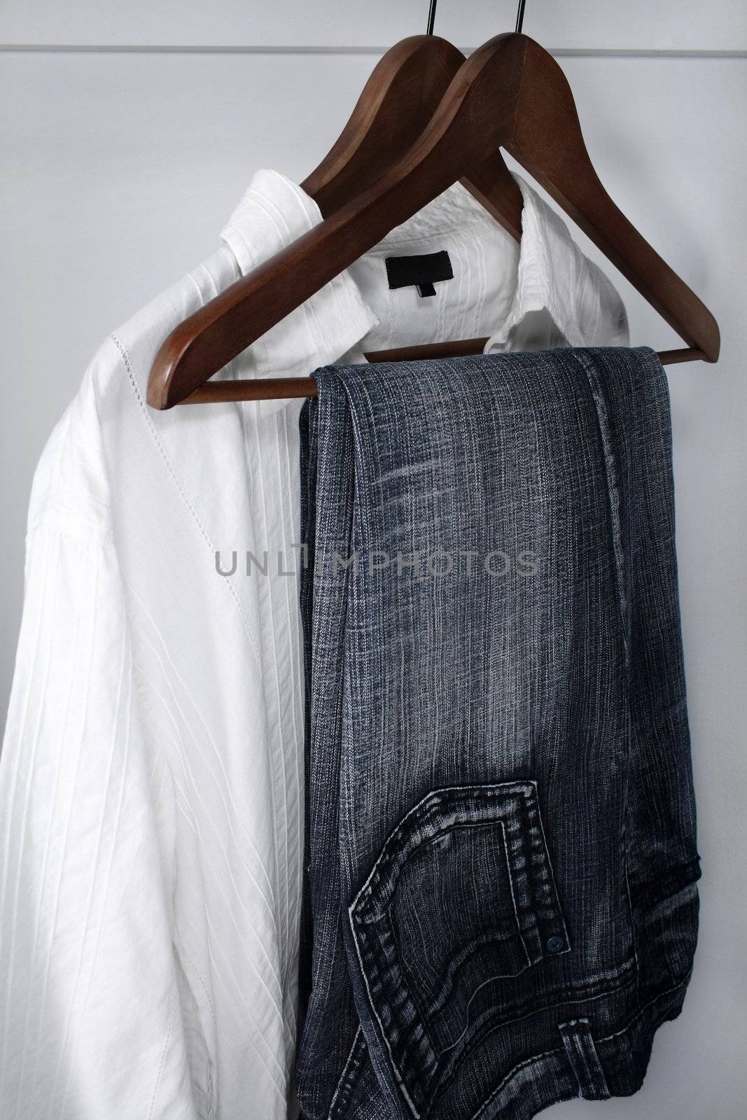 Man's clothing - blue jeans and white shirt by anikasalsera