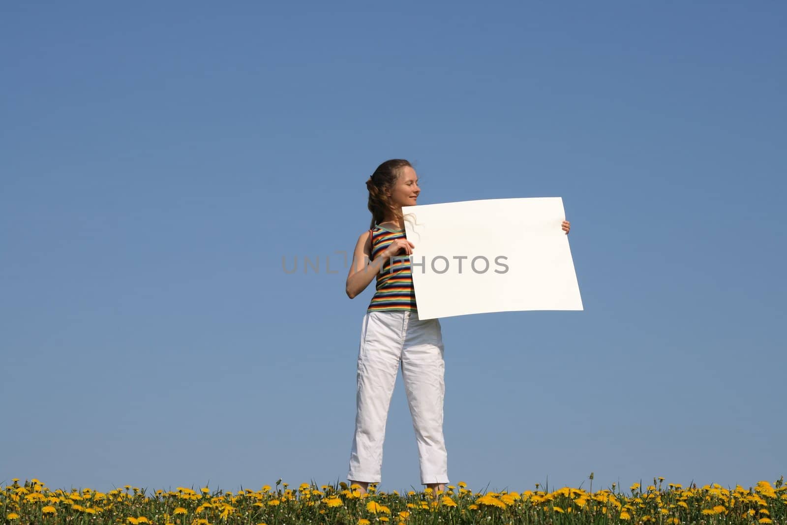 Girl holding blank banner with copy space by anikasalsera