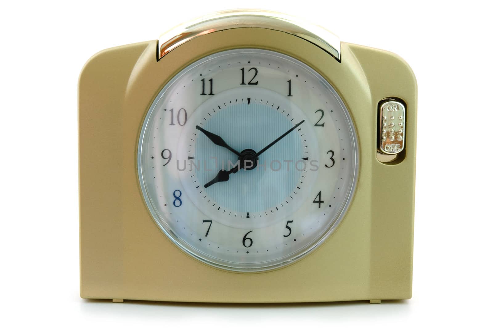 Alarm clock (with gold plastic body) on overwhite background.